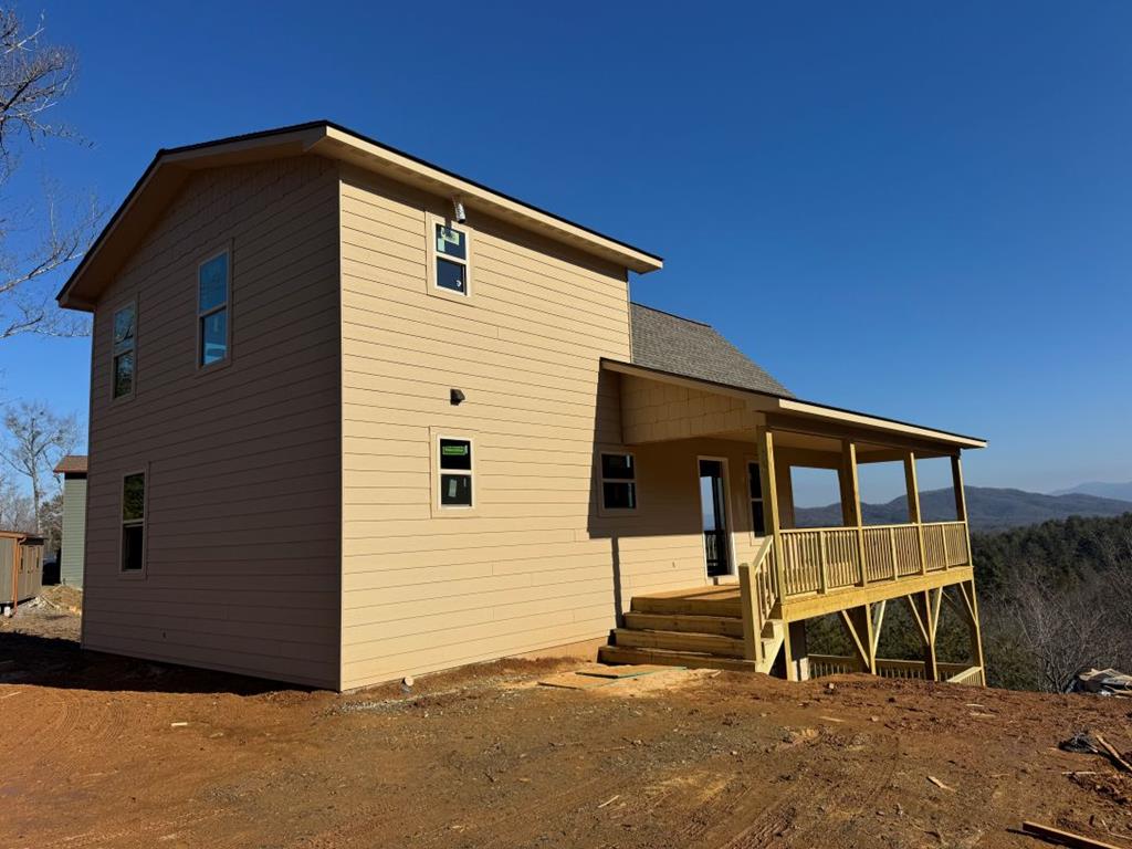 Brand new Chalet with long range mountain views!!! This home is a 2br/2ba with a full unfinished basement with hardwood flooring, pine ceiling, large walk-in closets, custom built kitchen cabinets with island and pantry area, rocked gas fireplace in great room area, and large covered porches. The home is located in Overlook Martin Creek Phase II subdivision with gated entrance, paved roads, and fiber optic internet service. This house offers good easy access. Owner/Broker