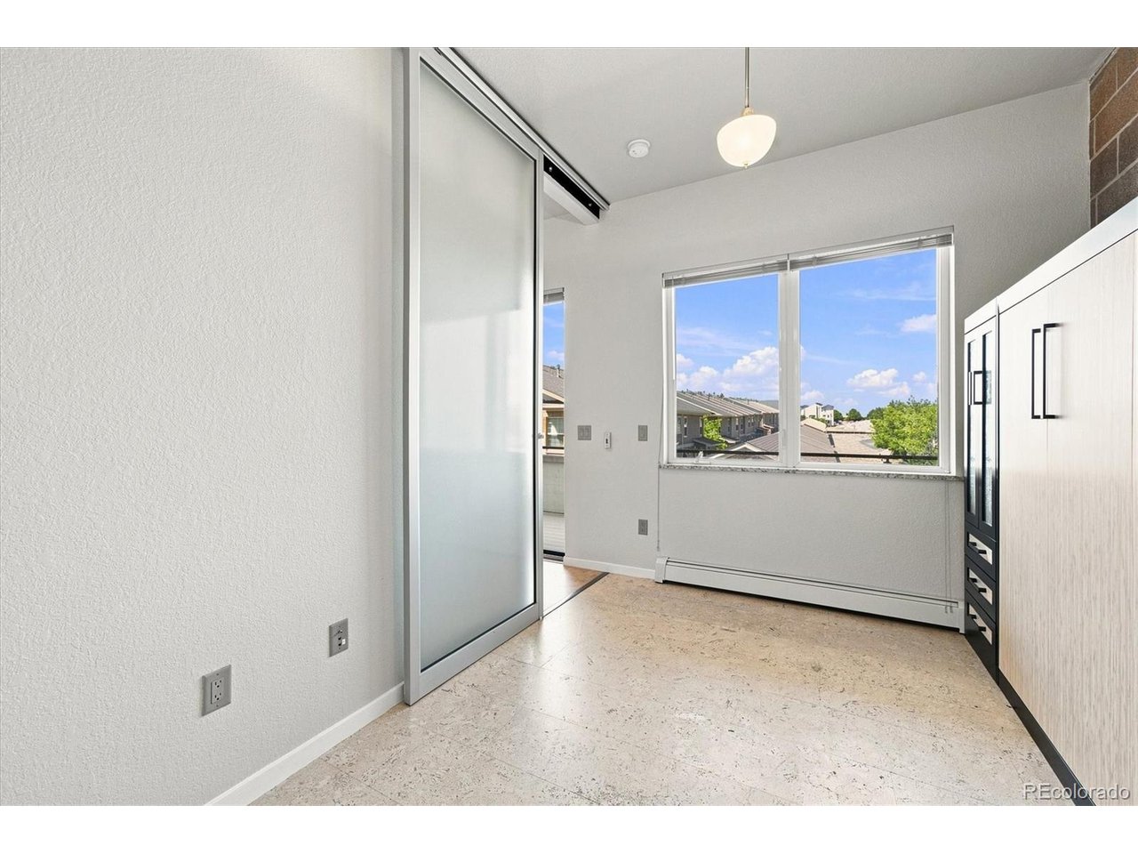 Perfectly situated between Denver and Boulder, this unique three-story live/work property combines flexible commercial space with stylish residential living above. The street-level suite is ideal for an office, studio, boutique or small business, offering a buffer from the private two-level residence above, a private bathroom and an attached 2 car garage! A dramatic open wood staircase and modern exposed beams draw you upstairs into the beautifully updated kitchen and open living spaces, where a private deck showcases incredible mountain views. Just off the kitchen, a versatile study/bedroom with Murphy bed and full bathroom offers the perfect setup for guests or a second home office. Third floor features the spacious primary suite and full bathroom plus huge loft that adds even more flexibility, while there is an additional private decks with the most stunning views. Both decks are trex decking! Washer and dryer included! Walk to Whole Foods, fitness, shopping and dining, with easy access to Denver, Boulder, major employers, Standley Lake and the Butterfly Pavilion. Community amenities include a pool, tennis courts and green space-a rare combination of style, location and true live/work flexibility.