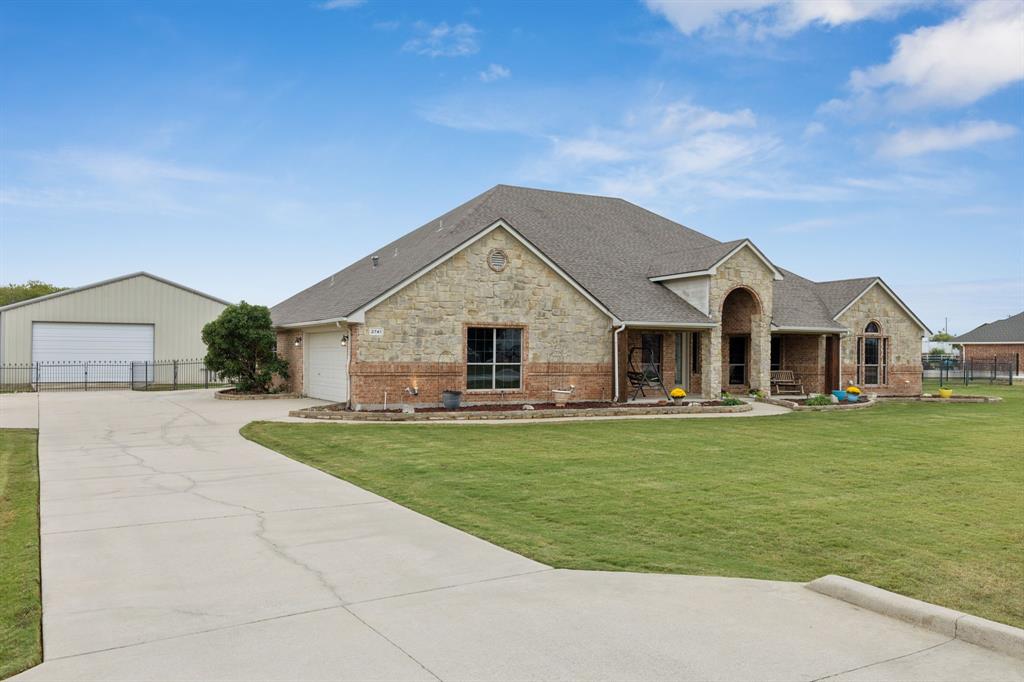 Beautiful 1.5-Story Entertainer’s Paradise on a Spacious 1-Acre Lot in sought-after Northwest ISD. Features a 40x50 shop with electric, plumbing, an office, and a full bath, perfect for versatile use. The home welcomes you with a large covered front porch and opens to a spacious floor plan. Inside, you’ll find a private office and guest suite. The kitchen and breakfast nook flow effortlessly into the family room with a cozy fireplace offering the ideal spot to relax. Upstairs, enjoy the large game room, half bath and spacious rooftop balcony. Outside, the sparkling pool, expansive covered patio, outdoor kitchen, and fireplace, provide the perfect setting for cookouts and gatherings. With a 3-car attached garage and an extended drive leading to the shop, this property truly offers it all for those who appreciate spacious, comfortable living. New carpet.