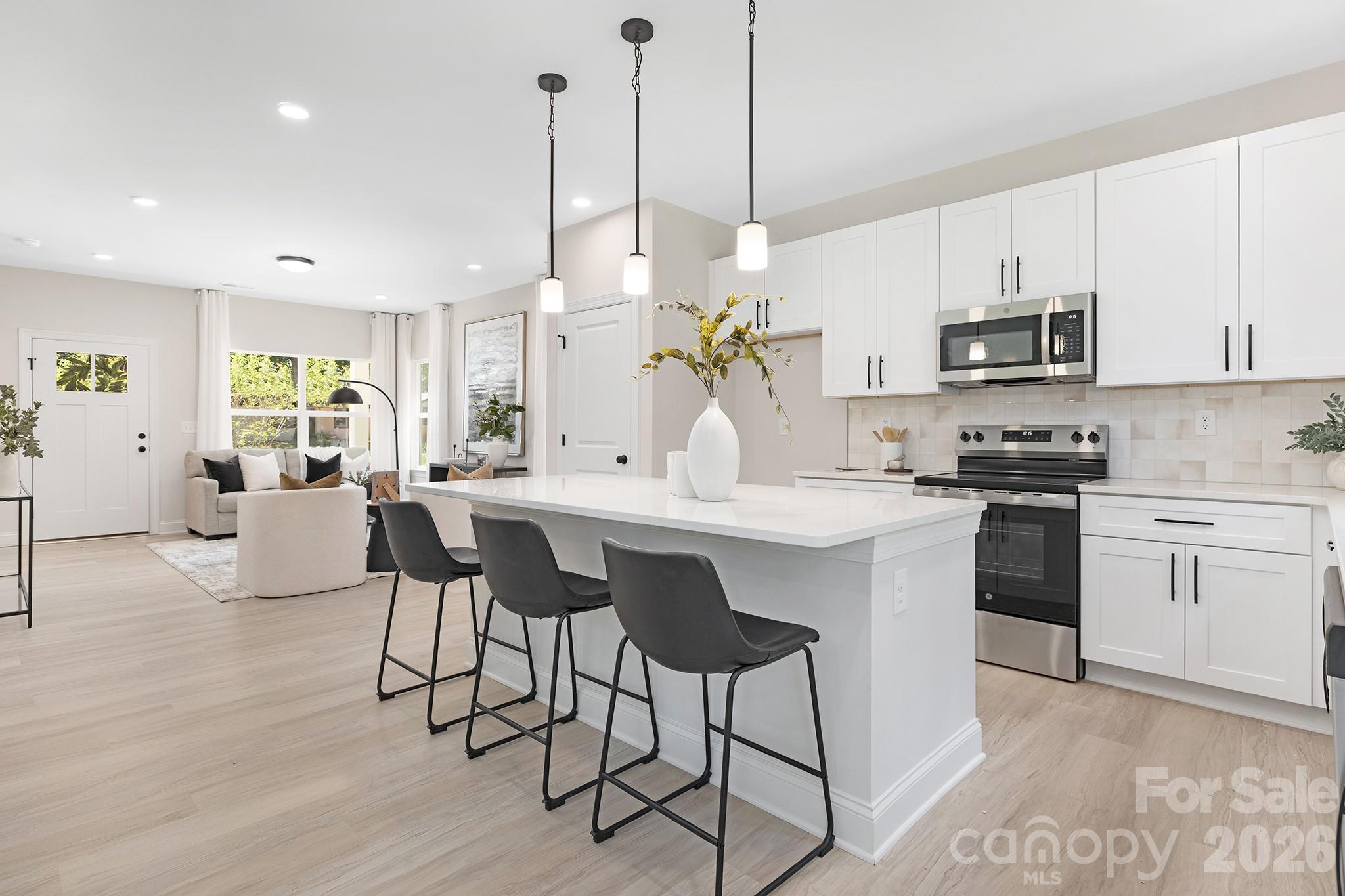 Move-in ready new construction home in Charlotte with a full package including a 6’ privacy fence, washer, dryer, refrigerator, and blinds, plus builder and preferred lender incentives featuring a 2-1 rate buy down with rates in the 4’s, eligibility for 100% financing, and up to $10,000 in closing costs. This stunning 5-bedroom single-family home at 7001 Ware Road is ideally located in East Charlotte near NoDa, Plaza Midwood, and Uptown Charlotte, offering quick access to some of the best restaurants, breweries, nightlife, and entertainment Charlotte has to offer, along with convenient proximity to shopping, grocery stores, and major highways for an easy commute. This open floor plan home features 9-foot ceilings on both levels and high-end finishes throughout, including quartz countertops, white shaker cabinets with 42-inch uppers, soft-close doors and dovetail drawers, and designer tile in the kitchen backsplash and bathrooms, making it a perfect option for buyers searching for modern homes in Charlotte NC or new construction homes near Uptown Charlotte. Additional upgrades include luxury vinyl plank flooring throughout, Pella windows and doors, fiber cement siding, stainless steel appliances, black hardware, and Moen plumbing fixtures, appealing to buyers looking for upgraded homes in Charlotte with durable and stylish finishes. The spacious primary suite includes an ensuite bathroom with dual vanity and a tiled shower, while the main level offers a dedicated home office, ideal for remote work or flexible living. A two-car garage, rear patio, and flat backyard provide outdoor living space that is hard to find in new construction homes in Charlotte. This turnkey home is perfect for first-time home buyers in Charlotte, investors looking for rental property near NoDa or Plaza Midwood, or anyone searching for affordable new construction with builder incentives in Charlotte NC. Don’t miss this opportunity to own a move-in ready home near Uptown Charlotte with modern upgrades, strong location appeal, and exceptional value.