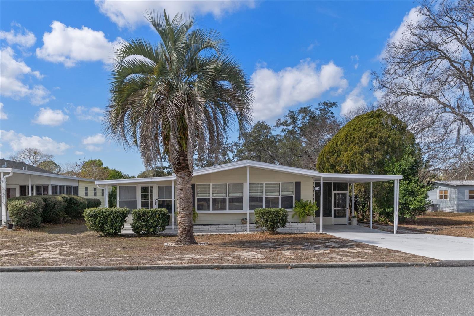 Completely updated and move-in ready 2-bedroom, 2-bath home featuring a bright and open floor plan designed for comfortable living and entertaining. The beautifully refreshed kitchen showcases all stainless steel appliances, modern finishes, and flows seamlessly into the main living areas. This home offers incredible versatility with not one, but two enclosed Florida rooms, plus a screened-in porch--perfect for enjoying indoor-outdoor living year-round. A spacious family room features a custom buit-in electric fireplace, The oversized utility room includes a dedicated laundry area and abundant storage space. Beautiful flooring runs throughout the home, complemented by new doors and windows for added style and efficiency. The primary suite is a true retreat, featuring a spa-like bath with a soaking tub, separate shower, and double sinks. Located in the vibrant, active 55+  High Point Golf Community offering tons of amenities such as Golf, tennis, pickleball, heated pool, social events and so much more with Low HOA fees and you OWN YOUR OWN LAND.