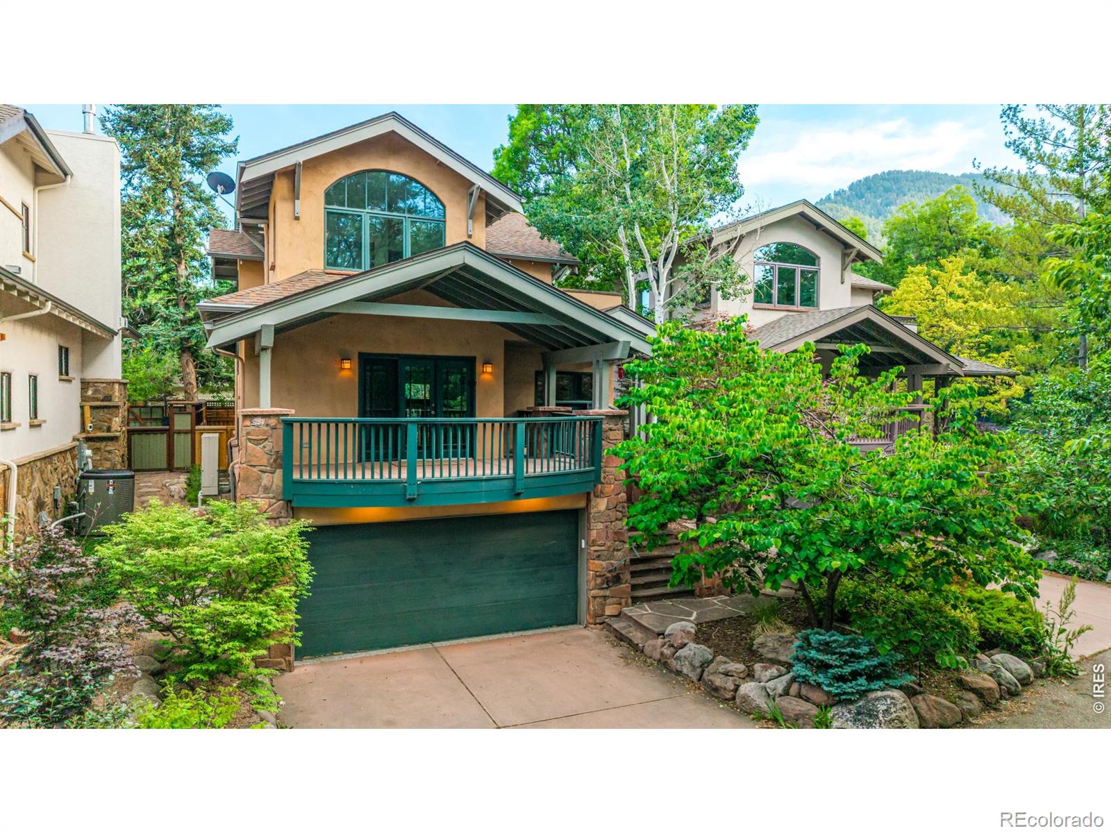It's rare to find a home that perfectly balances the pulse of the city with the serenity of nature, but 610 Streamside Lane hits that sweet spot effortlessly. Tucked away in one of Boulder's most coveted pockets, this 3-bedroom, 4-bathroom retreat sits right on the banks of Boulder Creek, offering a daily soundtrack of rushing water and rustling cottonwoods.The lifestyle here is all about accessibility. You're just a short, scenic stroll from the iconic shops and dining on Pearl Street, and equally close to the University of Colorado Boulder campus. Between the 2-car garage and the incredible walkability, it's the kind of location where you can ditch the car for the weekend and soak in everything that makes Boulder world-class.Inside, the home feels warm and intentional, anchored by custom hickory finishes that add a rich, organic texture to every room. The kitchen is a chef's delight, featuring newer appliances and a dedicated wine fridge-perfect for chilling a bottle of Rose before heading out to the patio. Designed as a sanctuary for both work and play, the main floor includes an inspiring home office with a private patio where you can leave the doors open to let the sound of the creek flow in while you work.Upstairs, both bedrooms serve as private escapes with their own dedicated balconies. The primary suite is a true standout, offering breathtaking views of the Flatirons to wake up to every morning. The layout flows naturally toward the outdoors, leading to a private backyard that feels like a secret garden-a lush, quiet escape right in the heart of town. For extra space, the fully finished basement includes an egress window, making it a bright and versatile spot for a media room or guest suite. Whether you're watching the sunset over the peaks from your balcony or hosting a dinner party by the water, 610 Streamside Lane delivers a living experience that is truly one of a kind.