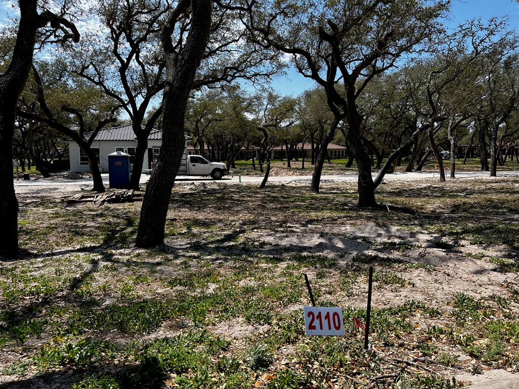 See what is behind the gate at Royal Oaks! The name says it all with majestic oak trees blanketing each lot. Only limited to one's imagination, this 3934 sq.ft. lot is ready for your custom build to commence. This exclusive gated waterfront community provides the pleasure of privacy with the storybook elegantly curved walls that line the front and back of the community. Entering the neighborhood over the cobble stone road from Fulton Beach Rd, past the guardhouse, immediately a rush of calm takes over. This therapeutic setting will be your place of peace and easy living. Take a minute to stroll the lighted walk paths to the gorgeous pool or gather under the gazebo. Invite friends for an evening around the fire pit to talk about the day on the boat while sipping on your favorite beverage. Need a little putting practice? Pick from the two greens overlooking the bay. Morning, afternoon or evening, the lighted fishing pier is the perfect place to drop a line.