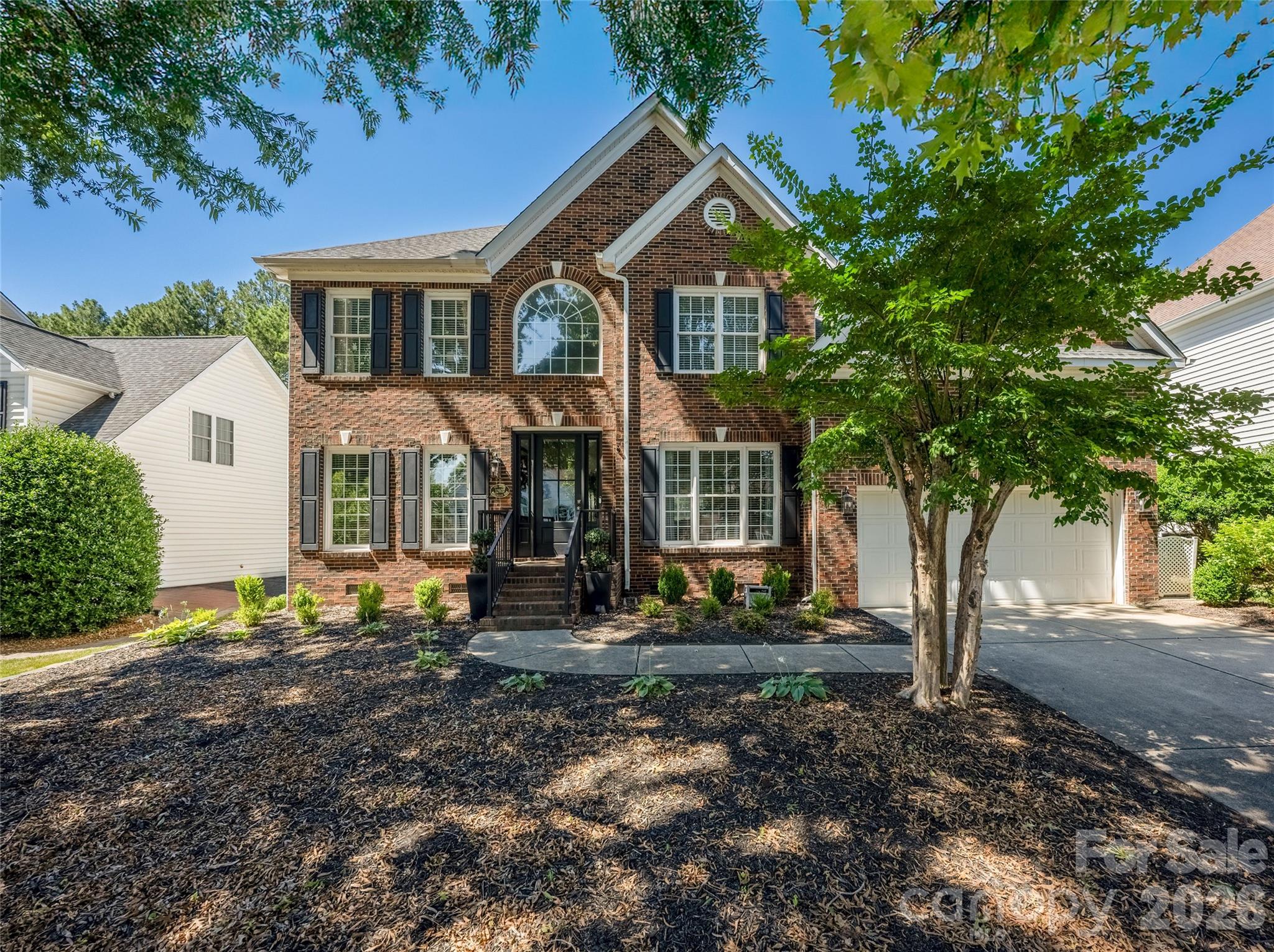A stunning move-in ready, 5-bedroom, 3-bath home located in the highly desirable Northstone community. Thoughtfully renovated, this updated open floor plan home offers the perfect blend of modern finishes, functional living spaces, and exceptional outdoor entertaining areas.  From the moment you step inside, you'll appreciate the fresh, cohesive design featuring new paint throughout nearly every room, updated lighting, new carpet, and countless designer touches. The striking kitchen serves as the heart of the home, showcasing freshly painted cabinetry, gorgeous Fantasy Brown countertops, a stylish backsplash, updated hardware, new sink, faucet, disposal, lighting, and refreshed pantry doors. Open to the breakfast area and living room with fireplace, the space is ideal for everyday living and is flooded with natural light. The flexible floor plan includes a main-level guest bedroom and full bath, dedicated office, and formal dining room. Upstairs, the primary suite offers a private retreat with updated flooring in the bath, designer lighting, a custom Closet by Design system, and refreshed finishes throughout. Secondary bedrooms have been updated with fresh paint, new carpet, and updated fixtures, creating comfortable spaces for family and guests. The oversized bonus/bedroom is the perfect spot for a playroom or theater, plus walk-in attic storage that can be easily finished to add extra living space. Enjoy evenings on the newly expanded Trex deck with integrated lighting, gather around the custom paver patio and fire pit, or shoot hoops with the in-ground basketball goal. Additional exterior improvements include enhanced landscaping with river rock accents, front and back exterior lighting, flagstone edging, and mailbox bed enhancements that add both beauty and functionality to the property.Located in one of Huntersville's premier golf-course communities, Northstone offers a sought-after lifestyle with convenient access to shopping, dining, top-rated schools, and major commuter routes. With extensive updates already completed (complete list attached to listing), this exceptional home is ready for its next owners to simply move in and enjoy.
