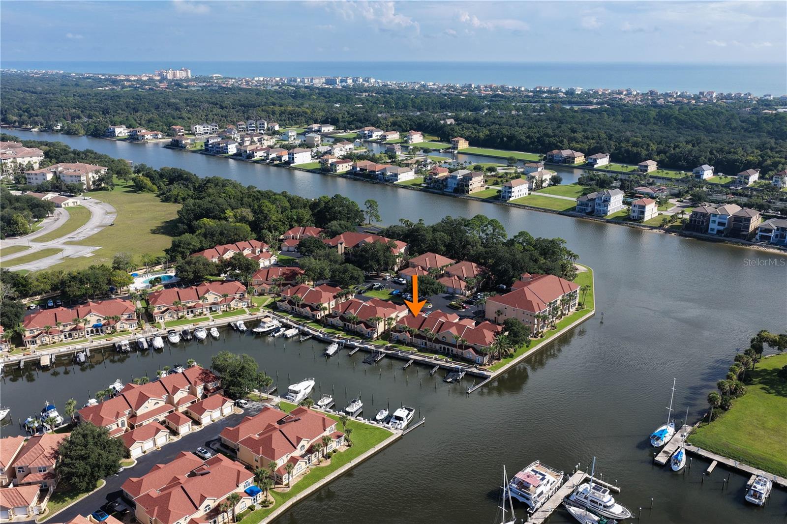 Spectacular partially furnished waterfront townhouse in the beautiful gated community of Marina Cove, ideally situated directly on the Intracoastal Waterway! This desirable end-unit offers breathtaking water and marina views and even has its own deep-water dock, which is also available for purchase separately. Step inside this partially furnished 3-bedroom, 2½-bath home with a spacious loft and discover a beautifully updated interior designed for comfortable coastal living.A charming front porch with a sitting area welcomes you to the solid wood front door and into the thoughtfully updated home. The renovated kitchen features solid wood cabinetry with crown molding, granite countertops, and a beautiful Travertine backsplash. The formal dining area overlooks the marina and Intracoastal Waterway and flows seamlessly into the spacious living room with soaring ceilings. A bright, enclosed lanai provides the perfect place to relax and watch the sailboats cruise by. The lanai is fully insulated and features fresh paint, new flooring, and plantation shutters.The downstairs primary suite is a private retreat with crown molding, gorgeous wood-plank flooring, and a custom walk-in California Closet and built in wall safe. The beautifully renovated primary bath features Travertine, custom soft-close cabinetry, granite countertops, and a glass-enclosed walk-in shower. A fully updated half bath is conveniently located for guests, while the under-stair closet provides additional storage.Upstairs, spacious guest bedrooms feature tray ceilings and generous closet space, while the versatile loft offers an ideal space for a home office, sitting area, or potentially a fourth bedroom. The oversized two-car garage provides plenty of room for vehicles, storage, and more, with extensive shelving, a utility sink, and attic storage.Additional features include a 2022 roof, fresh exterior paint, newer washer and dryer on pedestals, plantation shutters throughout, and a 2018 HVAC system with a Wi-Fi-enabled thermostat that has been regularly serviced.Enjoy spectacular sunsets and the relaxed waterfront lifestyle that Marina Cove has to offer. Community amenities include a clubhouse, swimming pool, pickleball, tennis, putting green, shuffleboard, boat and trailer staging area, kayak launch, pergola, and more. And don't miss the virtual tour for a great walkthrough of this exceptional waterfront property!