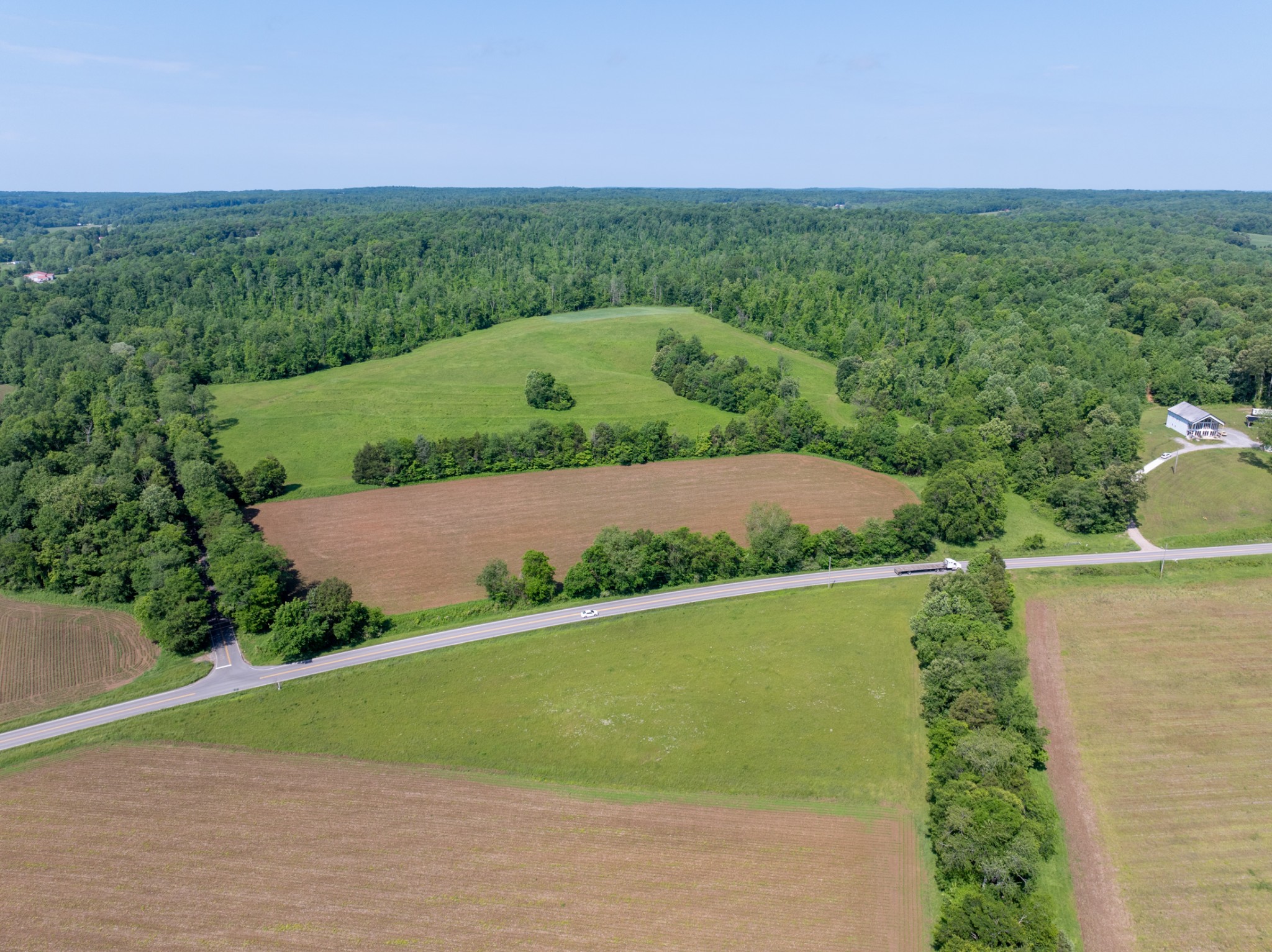 Multi-Generational Farm, first time ever on the market! Prepare to be amazed by this remarkable property, featuring approximately 159(+/-) acres situated along Highway 49 in Erin, Tennessee. Ideally located central to Dickson, Houston, and Montgomery Counties, this land offers the allure of country living while remaining just a short distance from vibrant towns that cater to all your essential needs.Having been a row crop farm for decades, this property embodies integrity and pride, reflecting its rich heritage. With road frontage along Highway 49 & Salmon Branch, this unique property offers the potential for a family commune with multiple inviting entry points. New Survey attached in Docs. This listing is a sub-listing of MLS#2888432(322+/-acres), check out the other sub-listings; 2 Highway 49-MLS#2888490(123+/-acres) & 3 Highway 49-MLS#2888497(32+/- acres)