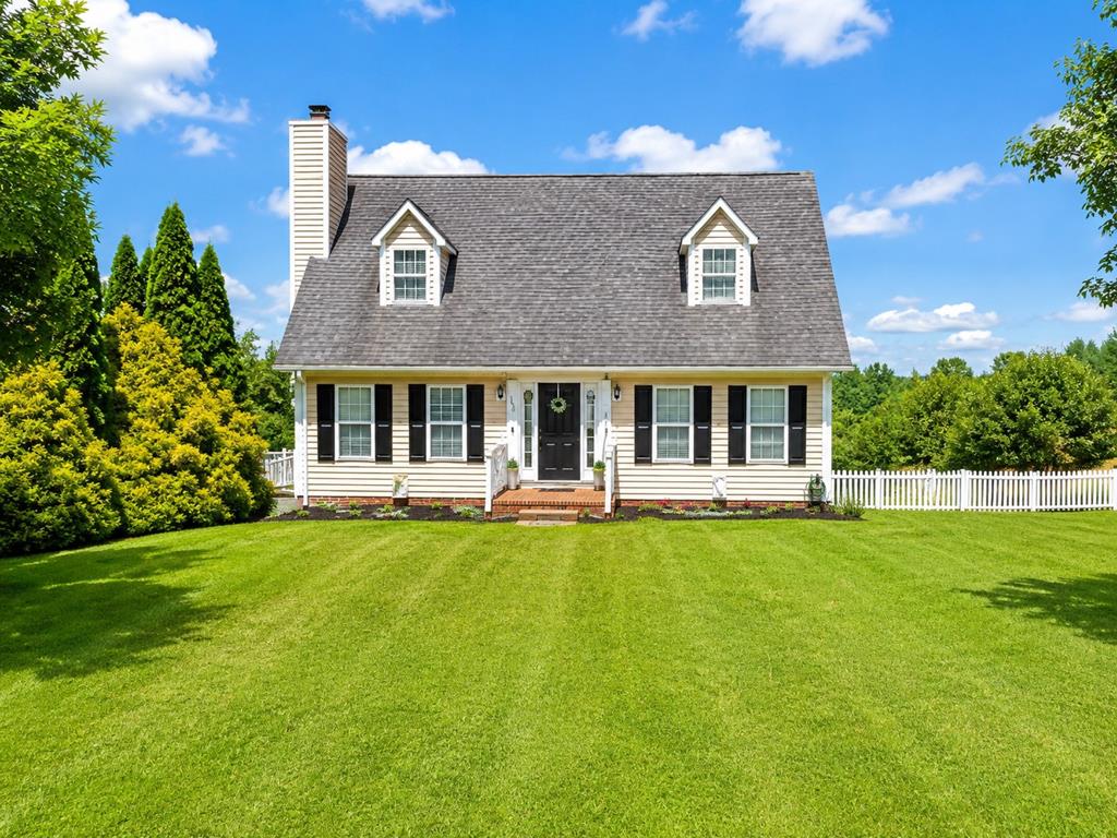 Beautiful Cape Cod home located in the desirable Fox Run Subdivision in Galax City! Situated in a nice neighborhood on a spacious, extensively landscaped lot, this home offers three bedrooms, two and a half baths, a fenced backyard and a paved driveway. The main level features a welcoming living room with hardwood floors and a fireplace, a well-appointed kitchen with oak cabinetry, Corian countertops, a tile backsplash and all major appliances conveying, along with a dining room, den, half bath and laundry area. Upstairs, you'll find a spacious primary suite with a walk-in closet and custom tile shower, plus two additional bedrooms and a full bath. The lower level provides an office, bonus room and a two-car garage. Conveniently located near shopping, grocery stores, medical facilities, schools and the New River Trail, this beautiful home offers comfort, space and an excellent Galax City location.