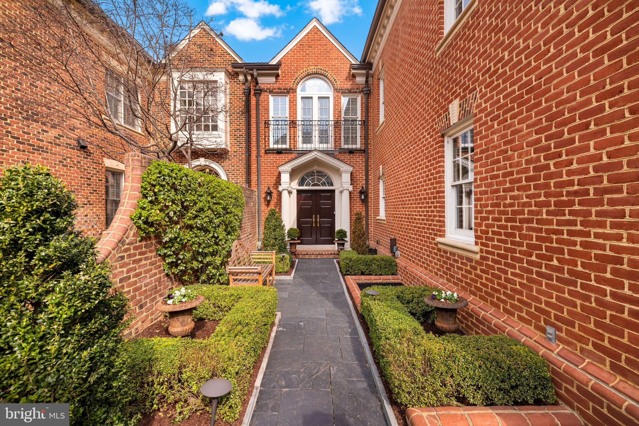 Best townhouse listing in McLean complete with generous outdoor spaces (courtyard/green space and balconies), lower level in law suite with separate entrance and kitchen large 2 car garage,  and garage sized storage unit.A sought-after home in one of McLean’s most desirable neighborhoods, 1215 Stuart Robeson Drive is a unique Georgian-style brick residence constructed to exceptional scale, with high ceilings, incredible light and appealing flow across approximately 7,000 square feet of finished living space. This elegant home seamlessly meshes refined craftsmanship with modern livability.A formal entry sequence ushers one into a dramatic two-story foyer, setting  the tone for the home’s generous proportions and high-quality finishes. The main level features a formal living room and dining room with custom built-ins, a fireplace, and large Palladian windows and French doors that open to a Juliet balcony. The space flows to an adjacent, relaxed family room. A chef’s kitchen is anchored by a large center island, custom cabinetry, premium appliances, and direct access to an expansive terrace.  There is an elevator that services three levels, and a discrete and elegant powder room.The second level is anchored by an expansive primary suite, offering cathedral ceilings, a sitting area, a phenomenal walk-in closet with significant storage, and a spa-inspired primary bath flooded with natural light. Two additional well-proportioned bedrooms share a full bath. A conveniently located laundry room compliments the private living space. The lower level is designed for entertainment and flexibility, with a large room featuring light and complemented with a fireplace.  The level opens directly to a private, beautiful, and spacious Georgian-inspired brick patio. A full second kitchen, wine cellar, bonus rlarge garage sized storage unit.A sought-after home in one of McLean’s most desirable neighborhoods, 1215 Stuart Robeson Drive is a unique Georgian-style brick residence constructed to exceptional scale, with high ceilings, incredible light and appealing flow across approximately 7,000 square feet of finished living space. This elegant home seamlessly meshes refined craftsmanship with modern livability.A formal entry sequence ushers one into a dramatic two-story foyer, setting  the tone for the home’s generous proportions and high-quality finishes. The main level features a formal living room and dining room with custom built-ins, a fireplace, and large Palladian windows and French doors that open to a Juliet balcony. The space flows to an adjacent, relaxed family room. A chef’s kitchen is anchored by a large center island, custom cabinetry, premium appliances, and direct access to an expansive terrace.  There is an elevator that services three levels, and a discrete and elegant powder room.The second level is anchored by an expansive primary suite, offering cathedral ceilings, a sitting area, a phenomenal walk-in closet with significant storage, and a spa-inspired primary bath flooded with natural light. Two additional well-proportioned bedrooms share a full bath. A conveniently located laundry room compliments the private living space. The lower level is designed for entertainment and flexibility, with a large room featuring light and complemented with a fireplace.  The level opens directly to a private, beautiful, and spacious Georgian-inspired brick patio. A full second kitchen, wine cellar, bonus room, large cedar closet, and an additional bedroom suite with a full bath - ideal for guests or extended stays - make up the rest of this expansive floor.A large and open exercise room, and a bedroom with full bath enjoy the benefit of light from the well-placed skylights.  There is also significant attic storage on the top level. This home offers access measured in minutes to D.C., to both major airports and to the surrounding countryside.  It is also well-positioned near McLean’s shops, dining, and commuter routes.