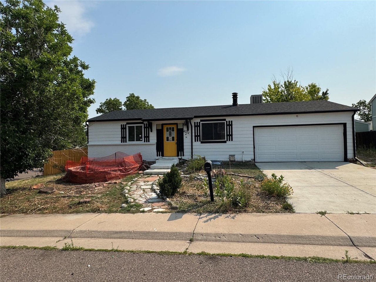Ranch style home with some updates on a corner lot in Summer Valley. No HOA. Approx. Square footage is 1,654 total sq ft with 838 sq ft on the main level and 816 sq ft in the finished basement. Some Main level updates are flooring, vaulted ceiling in the living area, & track lighting. The kitchen has white cabinets with gold hardware, laminate counters, and stainless steel appliances including range, built-in microwave, dishwasher, and refrigerator. Eat-in dining area off the kitchen with exterior door to the backyard sunroom. Both baths appear to have been remodeled in the past. Main bath: tiled tub/shower surround, vessel sink vanity, patterned tile floor. Basement bath: walk-in tiled shower. Two bedrooms on the main level & 3 additional bedrooms basement bedrooms (2 BASEMENT BEDROOMS ARE NON-CONFORMING). Basement has vinyl plank flooring and a separate laundry room; washer and dryer present. Enclosed sunroom spans the rear of the home. Large concrete patio with block retaining wall. Attached 2-car garage plus off-street parking, Approximately 4 spaces total.  Located Near Quincy Reservoir and Hampden Run, Pagosa, and Seven Hills Parks. King Soopers, Safeway, and Natural Grocers within a few minutes. Southlands and Arapahoe Crossings for shopping, dining, and theaters. Access to Buckley Rd, Parker Rd, and E-470.