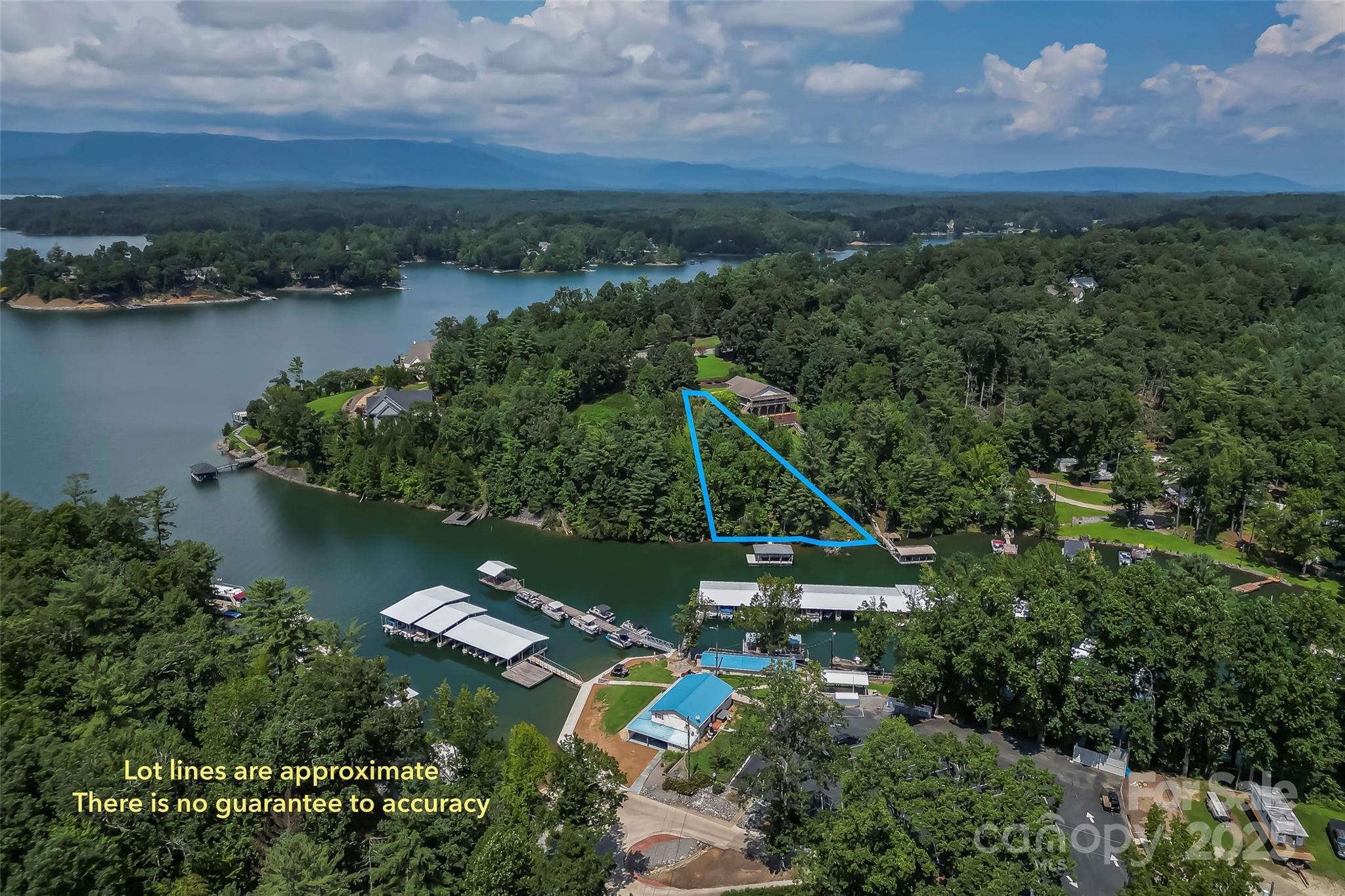 Don't just buy a vacant lot on lake James-buy this waterfront property has a covered aluminum dock for your boat already in place.  Located in the private East shores community with a culdesac location perfect for your Lake home.  The lot has been cleared and is ready to be built on.  Location adjacent to the Mimosa Marina so getting gas for your boat is a breeze.  No wake cove is perfect for swimming or floating and its just seconds out to the main channel for fishing, wake surfing, kayaking or paddle boarding. Community amenities are just down the street and include a outdoor pool, tennis & basketball court and pickle ball courts coming soon. Just 20 minutes to downtown Morganton for shops, dining and entertainment.  Great deal for waterfront with a great dock for under 300K!