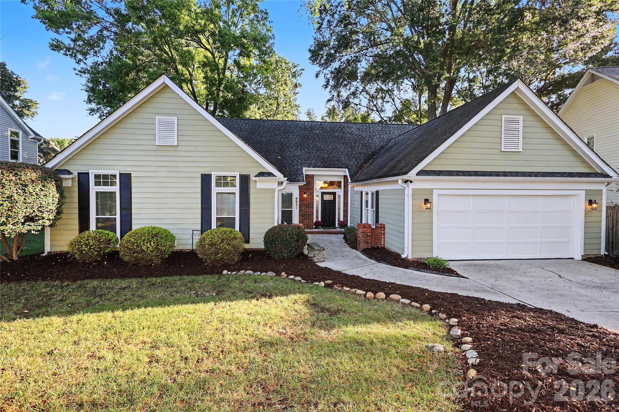 Welcome to one-level living at its best in Cameron Wood, a beautiful tree-lined South Charlotte community known for its inviting neighborhood feel and amenities. This beautifully updated 4-bedroom ranch combines timeless curb appeal with a bright, open floor plan, comfortable living spaces, and an exceptional outdoor setting.  The spacious living and dining areas flow seamlessly into a cozy family room featuring a gas-log fireplace, which opens to the breakfast area and updated kitchen. Designed for both everyday living and entertaining, the kitchen offers stainless steel appliances, a gas range, breakfast island, abundant cabinetry, and a pantry. The spacious primary suite provides a peaceful retreat with an ensuite bath featuring a soaking tub, tiled walk-in shower, and dual-sink vanity. Three additional bedrooms share a generously sized hall bath with dual sinks. Step outside to the beautiful screened porch overlooking the fenced backyard, where mature natural surroundings create a serene and private setting—an ideal spot for morning coffee, relaxing evenings, or entertaining guests. Additional highlights include an attached two-car garage with newly epoxied floors, offering ample room for vehicles, storage, hobbies, and more. A laundry room with brand-new washer and dryer adds everyday convenience. Fresh interior paint, along with numerous thoughtful updates, create a clean, refreshed, and truly move-in-ready home. Conveniently located just minutes from I-485, I-77, shopping, dining, and everyday amenities, this Cameron Wood home offers the perfect combination of one-story living, modern updates, a low-maintenance exterior, and a neighborhood setting you'll love coming home to.