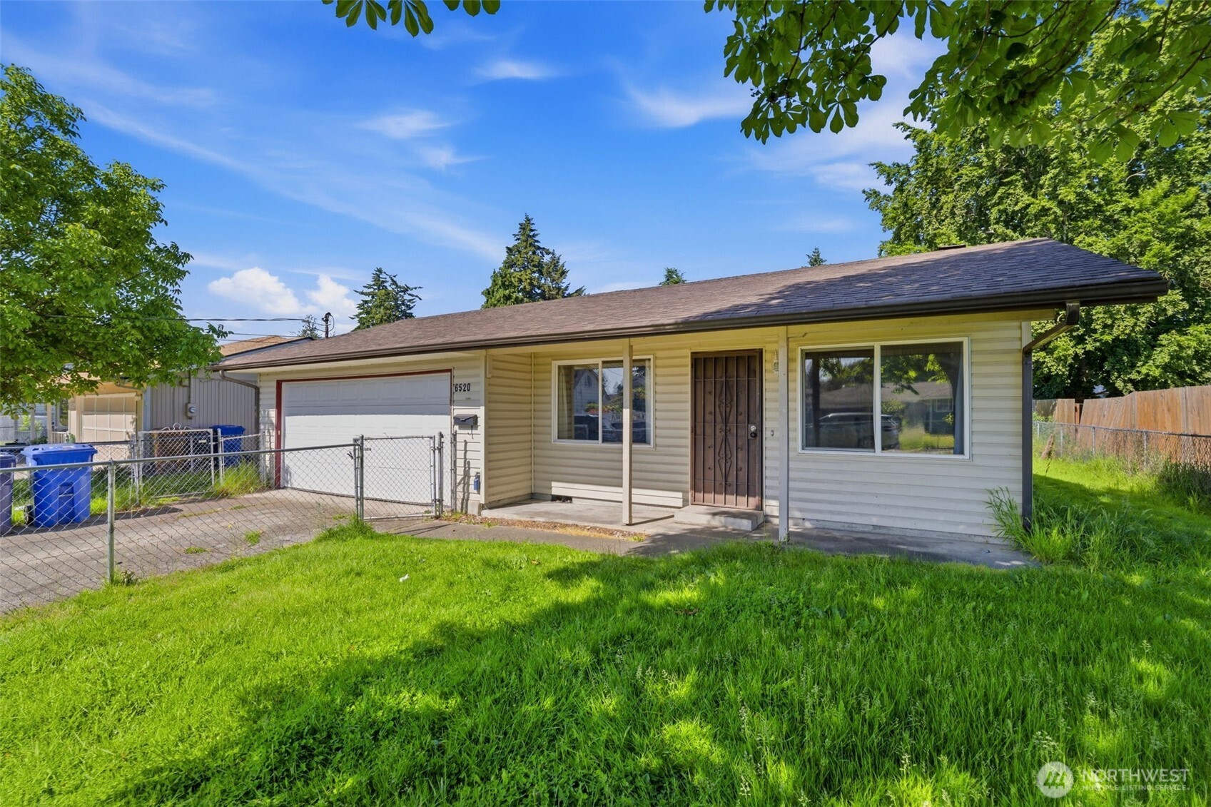 South Tacoma fixer with immediate sweat-equity potential. 3 bed, 1 bath, 1,028 sq ft on a generous 7,500 sq ft lot. Estate sale, sold AS-IS — seller will do no repairs. Cosmetic rehab can unlock upside; major systems updated: new electrical panel, water heater, roof, and plumbing. Expansive backyard offers plenty of room to add an DADU  (buyer to verify zoning, permits, and feasibility). Alley access, two-car detached garage plus driveway parking. Strong rental, flip, or long-term value-add opportunity — bring your contractor and vision. Buyer to verify all information.