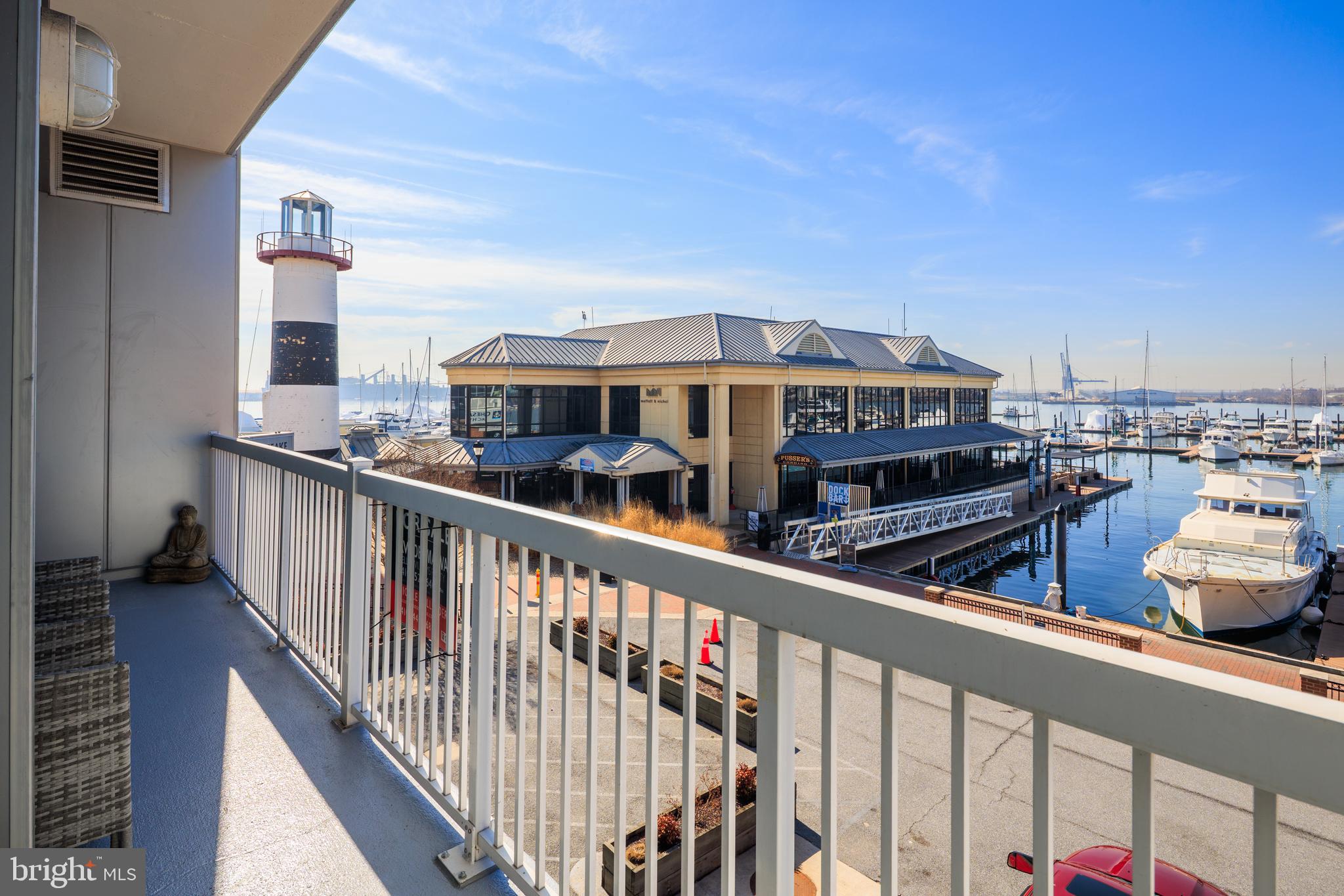 This is the ONE!!! Discover the epitome of waterfront luxury living in this exquisite 2300+ (to be verified) square foot condo located at The Beacon in the sought-after Canton Waterfront neighborhood. This stunning property offers a rare combination of sophistication, comfort, and breathtaking views, making it a perfect sanctuary for those who seek an unparalleled living experience. Features & Amenities: Spacious Open Floor Plan: Spanning a generous living space, this condo features a wide-open layout that seamlessly connects the living, dining, and kitchen areas. The floor-to-ceiling windows not only flood the space with natural light but also provide an unobstructed view of the waterfront, creating a serene and inviting atmosphere. Custom light fixtures and new LVP  flooring make this stunning condo pop! Bedrooms & Bathrooms: Comprising 3 well-appointed bedrooms and 2 modern bathrooms, this condo is designed to cater to the needs of a contemporary lifestyle. The primary suite, with its ample closet space and en-suite bathroom, serves as a private retreat where you can unwind and rejuvenate. Gourmet Kitchen: Equipped with top-of-the-line stainless steel appliances, granite countertops, and a center island, and dual colored cabinetry make this kitchen is a chef’s dream. Whether you’re preparing a meal for yourself or entertaining guests, the kitchen offers both functionality and style. Stunning Waterfront Views: Enjoy the mesmerizing views of the water from virtually every room. The expansive windows not only enhance the aesthetic appeal of the condo but also provide a constant connection to the natural beauty outside. Light filtering shades in the living room and room darkening shades/drapes  in the bedrooms make the best use of these amazing windows day and night! Gated Community: Offering peace of mind and security, The Beacon is a gated community. Residents enjoy exclusive access to the amenities, including secure parking, a fitness center, and outdoor spaces designed for relaxation and entertainment including a dog park just outside your door! Walkability to Canton: Situated in the heart of the Canton Waterfront, this condo offers unparalleled walkability to a variety of dining, shopping, and entertainment options. Experience the best of city living with the convenience and charm of a vacation-style community. Packages? Don't every worry about a delivery again as the building is secure and your packages will be as well!! Book your appointment today!!