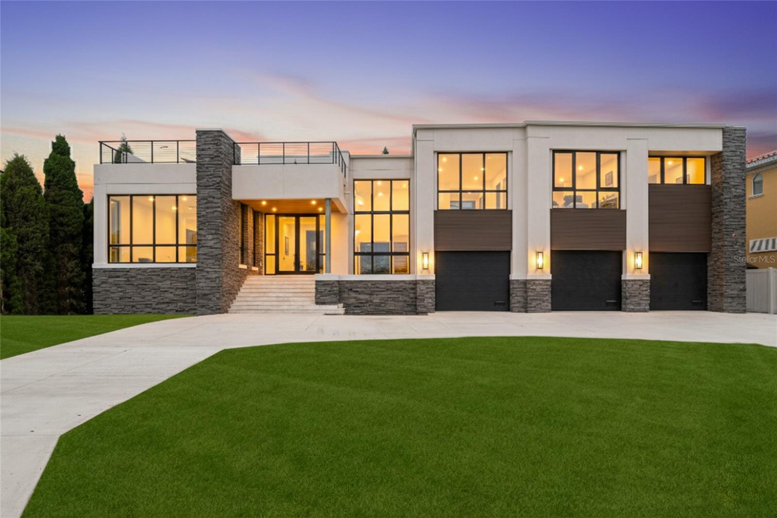 Under Construction. Open Bay views and unseen modern design on Davis Islands. This modern home is built for entertaining and ease of living by Forge Building Co. Enjoy spectacular open Bay views from much of the home with exceptional outdoor living spaces facing front and back. The home features 5 bedrooms, 5 and 2.5 baths, one room is a semi-detached guest suite, and an office, along with two outdoor kitchens: one on the back outdoor living space and one on the rooftop deck. Spectacular modern kitchen with built-in Gaggenau fridge and freezer, Gaggenau cooktop, and three Gaggenau wall ovens. The club room is entered thru pivoting doors and is the ultimate entertaining space. It includes a full wet bar, ice maker, and two built-in subzero 146 bottle wine coolers as well as plenty of room for pool table and has a double sided fireplace. The guest retreat off the Lanai offers a semi-connected bedroom for guests or family to enjoy. A second story "roof top oasis" will offer an amazing and unique space to relax or entertain. The 50'x15' pavered deck will include an outdoor kitchen complete with grill and fridge. Just off the roof top oasis, the semi-private Study with sliding glass doors offers a quiet place to relax or get some work done while enjoying endless open bay views. a bedroom completes the area. Spacious Master bedroom and bath with stunning views as well as private wet bar, private elevator access, sitting room, and fireplace. Separate Media room with fridges and plenty of space for any buildout you desire. Back porch will include an outdoor kitchen and overlook a beautiful pool and spa. Some of the appointments of the home include an elevator, 4 car tandem garage, impact-resistant window walls, almost all 2 story block construction, quartz and marble countertops thru out, built-out closets, and much more! Located on beautiful Davis Islands just across from the walking and bike path and just a short distance away from Davis Islands Village with many restaurants, shops, and bars. Bring your golf cart and enjoy the Island lifestyle with walking / biking paths, baseball fields, public tennis courts, public historic pool, two dog parks (one wet and one dry), a beach, public marina, and an airport. Located only minutes from Downtown Tampa, Water Street, Sparkman Wharf, and the Tampa Riverwalk, makes this neighborhood the most desired in South Tampa!