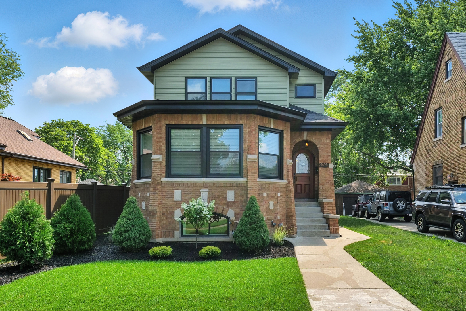 LUXURY LIVING IN A BEAUTIFUL BEVERLY HISTORICAL CHICAGO BRICK BUNGALOW! This home has been masterfully reimagined and meticulously rebuilt with added new construction which seamlessly blends its storied past with modern chic couture. The awe of the hand laid distinguished cut natural stone and brick trimmings with the art of vertical insets will immediate capture your vintage sculpture eye. As you pass through the grand solid handcrafted wood arched entryway, you are ushered into three levels of impeccably curated living, where historic architectural elegance seamlessly merges with modern sophistication and elevated bliss. Step into this stunning home, where sweeping curved brick architectural designed windows bathe the space in natural light. Boasting six generously sized bedrooms,  four luxurious full bathrooms. Every detail has been thoughtfully designed, dramatic black interior doors and ambient recessed lighting complimented by the elegant fixtures and hardware that elevate the home with timeless sophistication.  The main level showcases an elegant open-concept design, featuring premium white oak hardwood flooring throughout. , Expansive living and dining areas. Two spacious main level bedrooms, accompanied by a beautifully designed full bathroom and a sophisticated mudroom with handcrafted built-ins. The Professional Gourmet Gallery Kitchen is a true centerpiece, outfitted with a ZLINE Stainless Steel Autograph Series Kitchen Suite with a Commercial double oven stove, 4 door Refrigerator, dishwasher, built-in microwave drawer, a sleek pot filler, custom 42-inch  cabinets with custom molding, a peninsula and 9-foot island with a built-in Farm style sink anchors the space. Complemented by striking matte finished custom black quartz countertops and an opulent designed back splash, perfectly blending functionality with high-end exquisite showroom motif.  The second level features a den as you ascend the white oak staircase and three generously proportioned bedrooms. Get ready for a lavish owner's Primary Suite instilling a true sanctuary, complete with a large walk-in closet and a sumptuous five-piece spa-inspired ensuite with double sinks, a soaker tub and walk in shower with custom glass doors; designed for the ultimate comfort and relaxation. For added convenience, a dedicated laundry room is thoughtfully placed for quality living. Entertain in style and comfort on the spacious lower level, featuring a chic dry bar with quartz countertops, designer wall, open shelving, and a built in dual zone wine & beverage cooler, perfect for a cozy movie night or a lively game day gathering. Tucked just beyond, discover a private guest room; ideal for overnight visitors, in-laws, or a serene home office or home gym. This level also has a full bath with walk in shower. The oversized utility/laundry room, plentiful storage, and top-tier mechanicals that assist with duel central air systems while the drain tile system ensures year-round water protection.   Outside has been professionally landscaped. The backyard has been transformed into an Oasis with a two-car garage, an attached custom built gazebo with a hand laid wood ceiling, glazed hand stamped concrete patio, composite deck with wrought iron spindles, and a wood privacy fence. Get Ready for all your summer entertainment and morning coffee in this private paradise. This Scenic Home is  Ideally positioned in the prestigious heart of Beverly, this residence offers unparalleled convenience to an array of upscale amenities-including dining,  shopping, entertainment, the arts, schools, lush parks, and effortless access to transportation including The Metra rail which commutes to Central Downtown in 10 minutes . Contact us today to schedule an exclusive private tour and embrace the unrivaled lifestyle this premier residence promises.