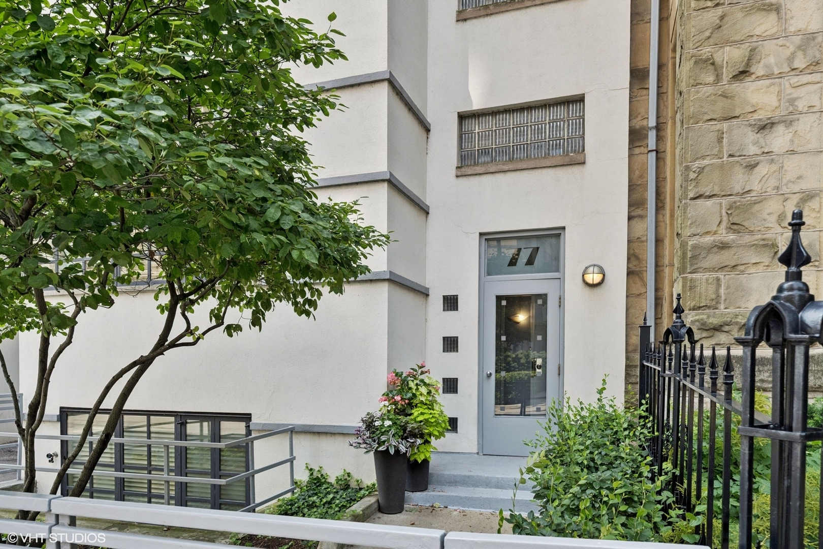 Nestled on a quiet block within an intimate, 2-story building, this 2800 SQFT penthouse duplex is ideally located in the heart of Chicago's Gold Coast neighborhood. Originally built in 1906, this home retains some of its vintage details including the original millwork and hardwood flooring in the living area. Walls of windows and a skylight over the staircase fill the home with natural light. The living room features a gas fireplace, ample room for two separate seating areas, and flows seamlessly into the open dining room. The updated kitchen offers granite counters, ample cabinetry, top-of-the-line stainless steel appliances, and a breakfast bar. The primary suite has a graciously sized bedroom, two closets, and an ensuite bathroom. The second bedroom has a large closet and is conveniently located right next to a full hall bath with shower. A laundry closet and additional storage space complete the first level nicely. Upstairs, the third bedroom is currently set up as a family room and features a walk-in closet, a full bath, and two incredible, private terraces complete with stone flooring, outdoor lighting, a gas line, and landscaping. It is the perfect space for entertaining, urban gardening, dining alfresco, or simply relaxing. 77 E Division is located within close proximity to the lake front, Oak Street Beach, 5-Star Dining, world class shopping, entertainment, public transit, and Lake Shore Drive. Rental garage parking available next door at 1150 N LSD and 1212 N LSD. Welcome home!