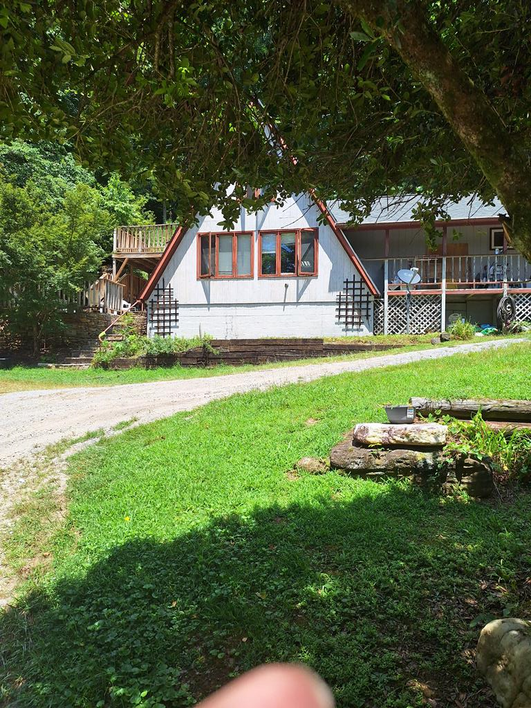 1.75 acres with A frame home. Downstairs has 2 bedrooms, 2 bath. Beautiful rock patio and setting area. Additional living space upstairs. Private, non-restricted. You will have a lake view in the winter when leaves are down.
