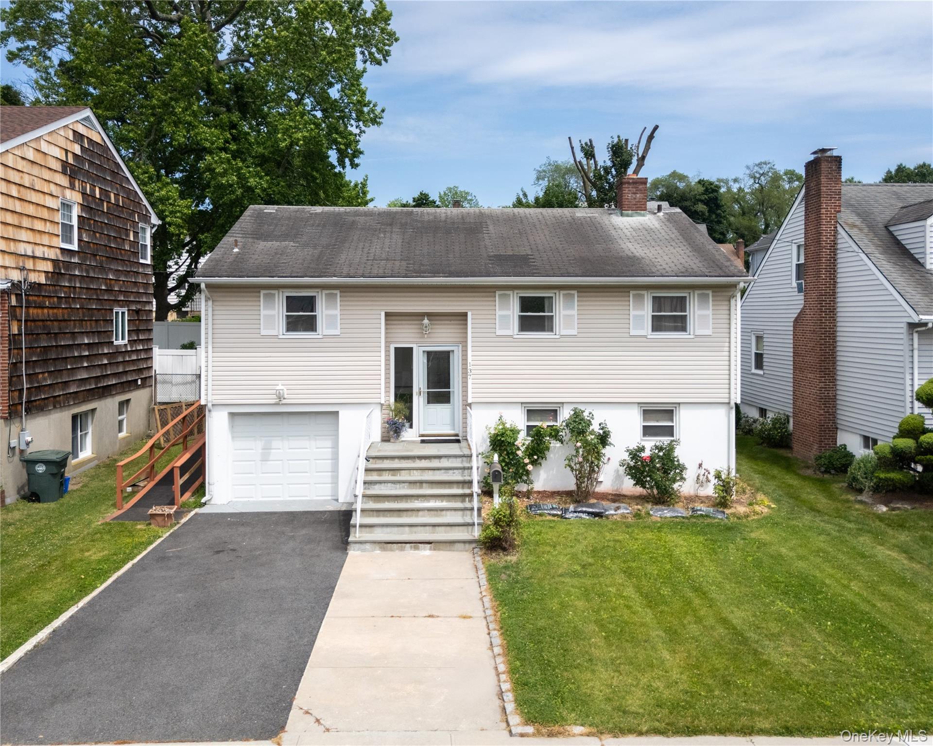 Raised Ranch om .12- acre lot.  Home offers open floor plan. Kitchen,living room/dining room combo access to deck. Primary bedroom, bedroombedroom, hall bath.Lower family room, utility room, bathroom access to one- car garage.