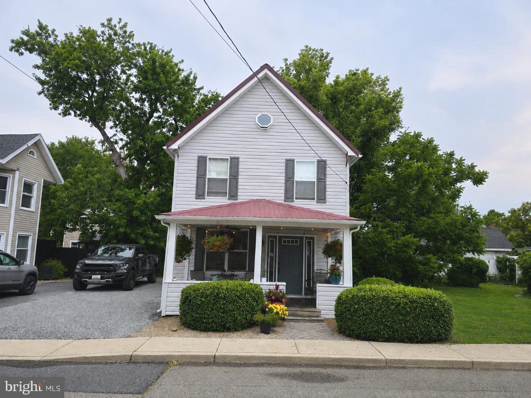 Step into this charming 2-story home in the heart of downtown Berlin, MD—proudly known as “America’s Coolest Small Town.” Just steps from shops, dining, and local events, this property perfectly blends small-town charm with modern convenience.  Inside, you’ll find 3 comfortable bedrooms and 1.5 baths, offering   an easy, functional layout for everyday living or a weekend getaway. The inviting front porch is made for sipping coffee, chatting with neighbors, and soaking in the vibrant energy of downtown life!Out back, discover your own private oasis. The fenced yard features a dedicated grilling and entertaining area, an adorable chicken coop, and a small garden ready for your herbs and flowers. Tucked neatly on the property is a 320 sq ft guest house (counted in total square footage)—ideal for hosting friends and family, creating a studio or home office, or exploring rental potential (subject to local regulations).With its unbeatable location, welcoming outdoor spaces, and bonus guest house, this downtown Berlin gem offers a rare opportunity to live, relax, and connect right in the center of it all. Newly renovated with new flooring, kitchen counters, appliances, fresh paint, and new air handler AI was used to stage furnishing in bedroom 2 and the guesthouse*