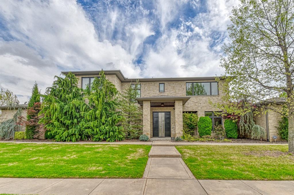 One of a kind luxurious contemporary home.  Hardwood floors & top quality features throughout.  Open floor plan with many views of gorgeous courtyard pool.  Downstairs: 3 Beds plus office, each bed with full bath and walk in closet. Above ground storm shelter.  Fantastic kitchen with giant island, gas cooktop, commercial vent hood, double ovens, warming drawer, pot filler, vegetable sink and incredible fixtures. Large living area with special fireplace, remote control window blinds and nearby wine bar with sink, set ups & half bath.  Large laundry room with sink and loads of storage. Luxurious Primary Suite with fireplace, his/her closets, incredible bathroom with its own fireplace and wine fridge.  Upstairs:  All hardwood floors, large upstairs living/entertainment room with full kitchen, balcony overlooking pool and giant picturesque window with incredible views.  Additional Lg bedroom with full bath as well as hallway half bath.  Outside: Incredibly large courtyard with beautiful pool, hot tub, huge fireplace, covered living area with cooking set up for all your grilling needs as well as full bath. Heavy wrought iron gates, lots of privacy & very peaceful.  Oversized double lot with plenty of grass for dogs and play area. Giant parking area to hold many cars. Oversize garage and private gated entrance. Soccer, basketball, walking track right next door. Must see home!