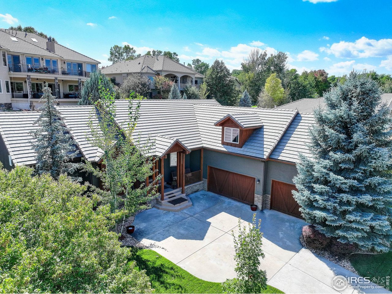 No Metro Tax - Experience refined living in Loveland's prestigious Reserve At Mariana Butte. This beautiful home features a open floor plan with peaked great room ceilings, a stone-framed fireplace, with built-in cabinets, and wood floors with herringbone inlay tile set the stage for elegance. The gourmet kitchen features granite counters, high-end SS appliances, large island and Kitchen Craft cabinets offering an abundance of storage. Plenty of room for a beautfiul formal dining room table if you wish or maybe the grand piano or cozy sitting area. The main floor primary suite offers a two-sided fireplace, his and her closets, a large bathroom with walk-in shower and double vanity. The bonus is a finished upper level that is perfect for guest...it includes a bedroom with full bath and a large 18'x16' flex room. The expansive unfinished basement provides endless potential or just great storage or craft space. Not ready for a patio home living but just want less work....then you will enjoy the smaller back yard with lower maintenance (higher quality astro turf in back only) and nicely landscaped. Entertain on the composite deck with electric awning for shade and privacy or explore nearby golf, trails, and foothills. The 938 sq ft 3-car garage includes an automatic stair lift. Updated mechanical include Lenox Furnace (2024), 50 gal water heater (2023), fresh exterior paint (2022), composite decks (2021) 2 electric awnings (2024) this home blends modern comfort with timeless style in one of Loveland's most sought-after communities. .