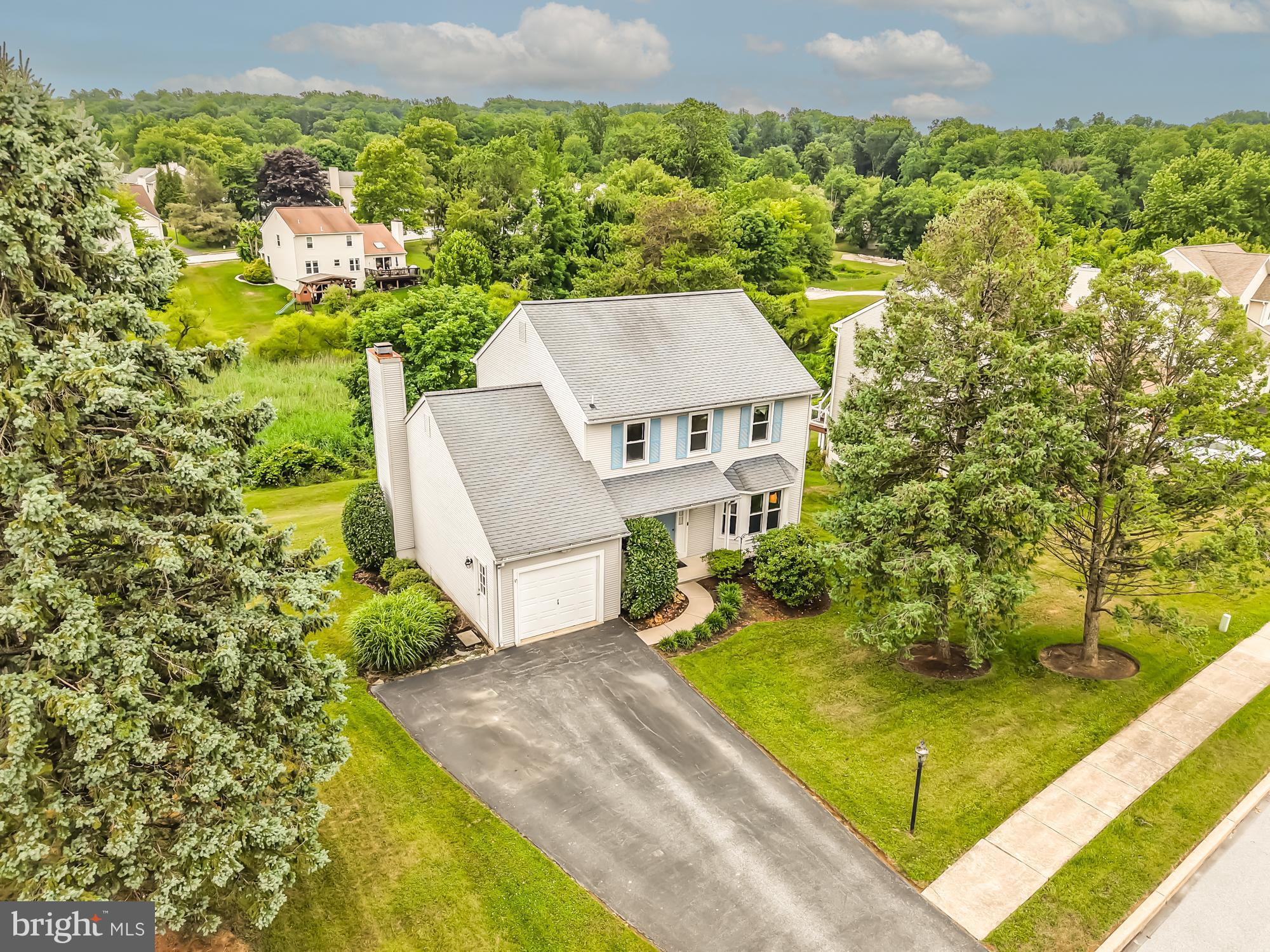 This impeccably maintained 3 bedroom, 2.5 bath home with a full, finished, walk out basement is located on one of the most desirable lots in the sought-after community of The Seasons.  The two story foyer welcomes you to the neutrally decorated, open floor plan.  An updated kitchen with granite counters, dimmable under cabinet LED lighting, a custom backsplash and stainless appliances is open to the great room.  Enjoy the wood burning fireplace on cold nights. Sliders lead to the large trex deck equipped with integrated LED lighting overlooks wooded open space, providing privacy and beautiful views. The laundry/mudroom has garage access.  A formal dining room, spacious living room, and a half bath complete the main level. Upstairs the primary suite offers a walk-in closet, a large ensuite bath with a double bowl vanity plus two additional bedrooms and a full hall bathroom. The lower level offers fabulous additional space with an open gathering area, a separate office or media room and a clean, dry storage area.  All the work has been done including a transferable lifetime window warranty, just move in and enjoy! Located a quick easy walk to the neighborhood playground in the award-winning Downingtown School District and just minutes from shopping, schools and major roadways.