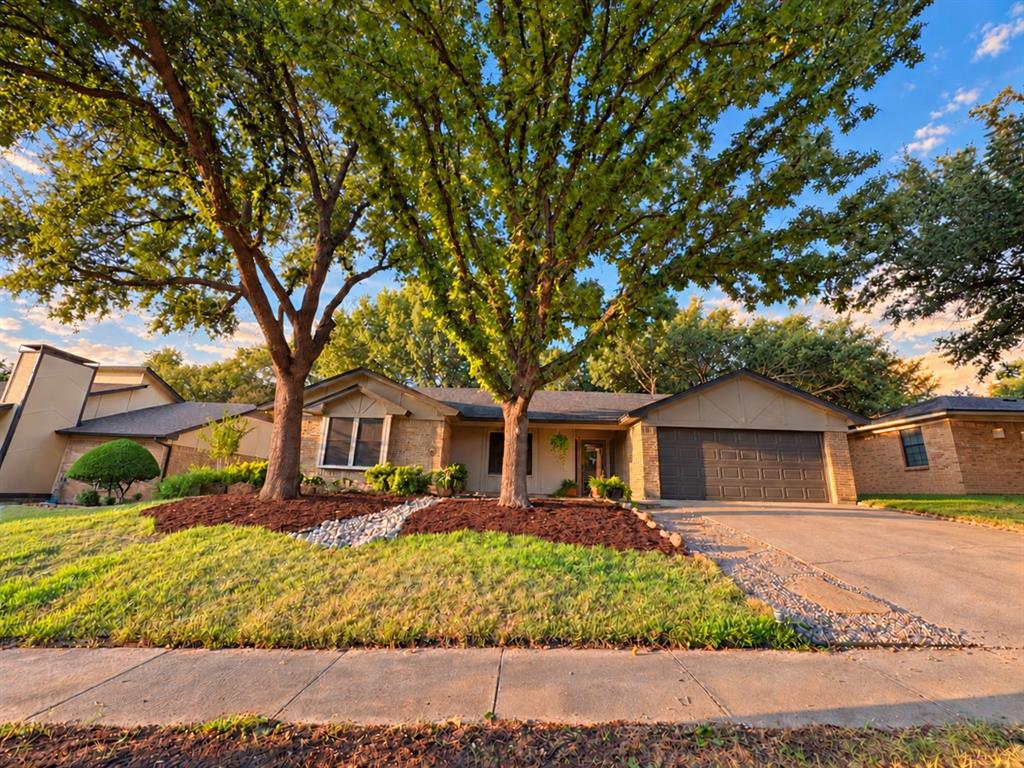 Well-cared-for Tudor-style ranch in an established North Bedford neighborhood, zoned for desirable H-E-B schools. Mature trees and refreshed landscaping create an inviting setting, while the private backyard offers plenty of shade and a large 12x20 deck—perfect for relaxing or entertaining.Inside, new wood-look tile flooring flows throughout the home, combining durability with an updated, stylish appearance. The spacious kitchen is designed for both cooking and gathering, featuring solid-surface countertops and new appliances. Fresh interior paint, new interior doors throughout, and new exterior doors with storm doors add to the move-in-ready appeal.Updated bathrooms feature quartz countertops and new toilets. The spacious primary suite offers a newly updated shower and TWO large walk-in closets, while additional bedrooms also provide generous walk-in closet space. A new roof was installed in 2024.Location is another standout! Just minutes from Generations Park at Boys Ranch, offering 68 acres with a lake, fishing, jogging trails, baseball fields, and the YMCA with an indoor pool and outdoor water park. Convenient access to Hwy 121, 183, 360 and 161 makes commuting around DFW easy, with DFW International Airport, shopping, dining and everyday conveniences nearby.A beautifully maintained North Bedford home with thoughtful updates, a fantastic location and plenty of space to enjoy!
