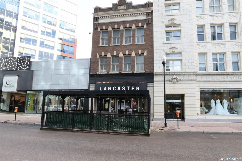 This historic three-storey building is located in the heart of Downtown Regina, surrounded by prominent local businesses and notable landmarks. The top two floors are available for lease, offering approximately 2,500 sq. ft. per level. These flexible spaces are well-suited for a wide range of uses, including office environments, studios, meeting rooms, or workshop space. The landlord is open to subdivision and will work with the tenant to customize the space to their requirements. The main floor is home to Lancaster Taphouse, a long-standing and well-established anchor tenant.