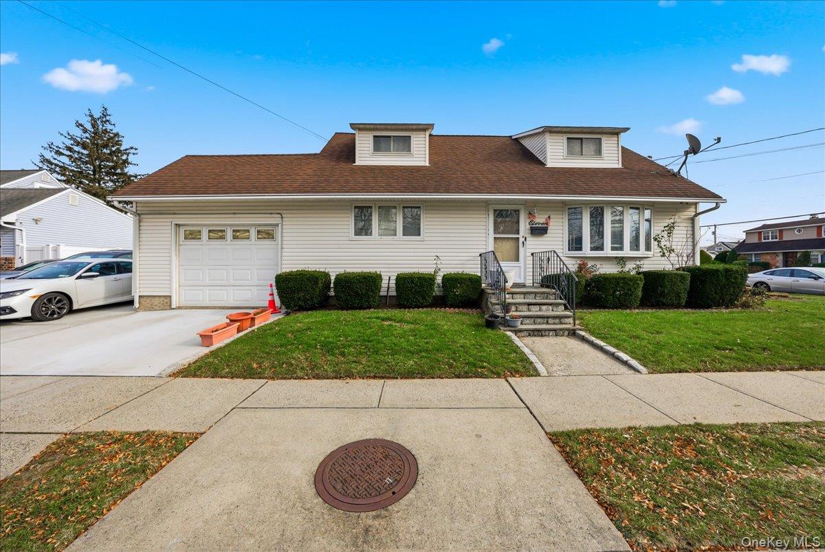 Discover this beautifully renovated single-family detached home sitting proudly on a corner lot—truly move-in ready with modern upgrades throughout. Step inside to gleaming hardwood floors, a warm and inviting living and dining room combo, and a stylish kitchen featuring stainless-steel appliances and a dishwasher. The home offers 4 well-sized bedrooms and 3 full bathrooms, along with a carpeted staircase leading to comfortable upper-level living. The full finished basement provides valuable bonus space plus a convenient washer and dryer. Outside, enjoy an attached garage and an oversized private driveway with room for up to 6 cars—perfect for guests, work vehicles, or multi-car households. Heating is powered by oil, complemented by efficient split-unit systems for year-round comfort. A small, low-maintenance backyard adds just the right touch of outdoor enjoyment. A rare opportunity to own a renovated, spacious home with exceptional convenience and curb appeal.