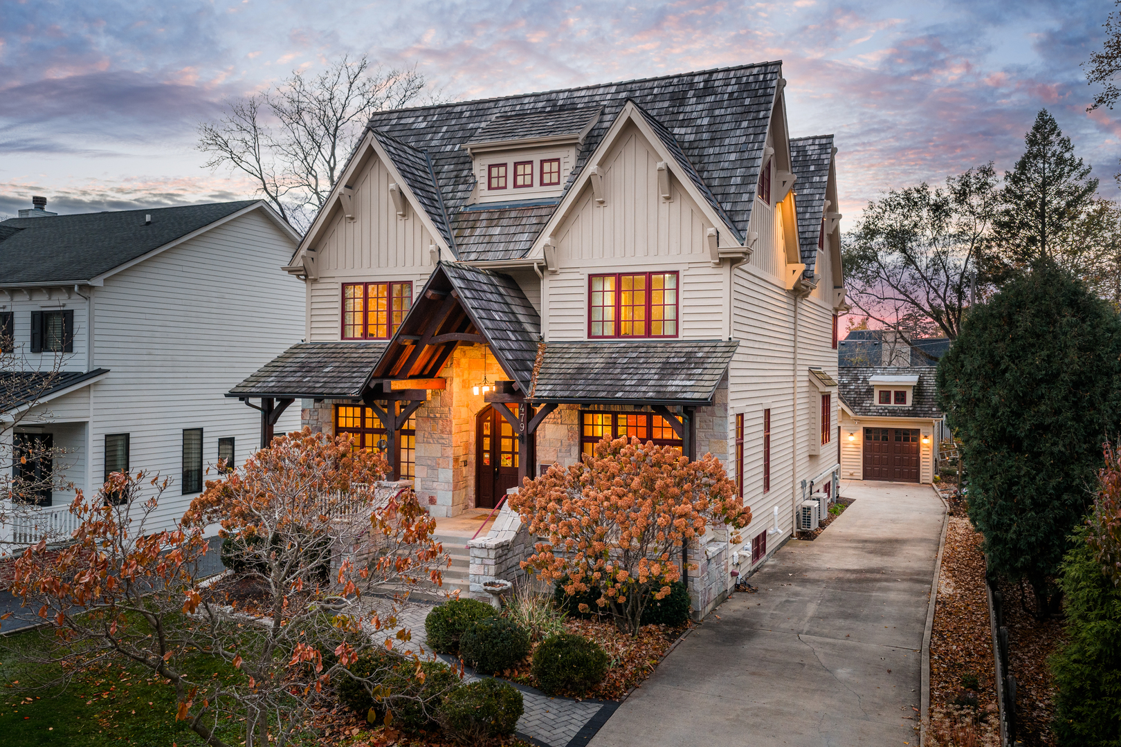 Perched at the top of the hill on highly sought-after Julian Street, this stunning custom residence offers timeless architecture, exceptional craftsmanship, and an unbeatable walk-to-downtown Naperville location. A welcoming covered front porch and impressive curb appeal introduce this stately home, thoughtfully designed for elegant entertaining and comfortable everyday living.    The interior is flooded with natural light and showcases recently refinished hardwood floors throughout in a sophisticated light gray stain, complemented by updated lighting and refined finishes. The main level features a gracious living room and formal dining room, ideal for gatherings, along with an updated powder room.    At the heart of the home is the chef's kitchen, impeccably appointed with custom Knotty Alder cabinetry, a paneled Sub-Zero refrigerator, two Sub-Zero refrigerator drawers, Wolf range with pot filler, paneled Bosch dishwasher, built-in pantry, and expansive granite countertops. A dedicated bar area with a striking barreled ceiling and wine storage flows seamlessly into the family room, where a beautiful stone fireplace anchors the space and walls of windows bathe the home in natural light. A private first-floor office features Knotty Alder wood trim, built-in desk, and custom cabinetry-an ideal work-from-home retreat.    Upstairs, the primary suite enjoys its own private wing, offering a serene retreat with a spacious walk-in closet and a luxurious bath featuring dual vanities and refined finishes. Two additional bedrooms share a well-appointed shared bath, while a fourth bedroom offers the privacy of its own en suite. The convenience of a second-floor laundry area completes this level.    The third floor provides exceptional flexibility, featuring a private fifth bedroom with a full bath and an expansive open space-perfect for a game room, additional family room, media lounge, or creative retreat.    The deep-pour finished basement impresses with tall ceilings and outstanding versatility. Designed for entertaining and function, it includes a full bar with Knotty Alder cabinetry, granite counters, JennAir full-size refrigerator, Bosch dishwasher, and microwave. A striking stone fireplace with gas insert creates a warm gathering space, complemented by an open staircase that enhances the home's architectural flow. This level also features a fully updated full bath, a spacious second laundry room, extensive storage, dual furnaces, and two water heaters.    Outdoor living completes the experience, offering inviting spaces to relax or entertain, surrounded by mature landscaping and an outdoor fireplace. Located just steps from Highlands Elementary, North Central College, downtown shops, restaurants, and the Riverwalk, this extraordinary home blends luxury, layout, and location-a rare opportunity to experience Naperville living at its finest.