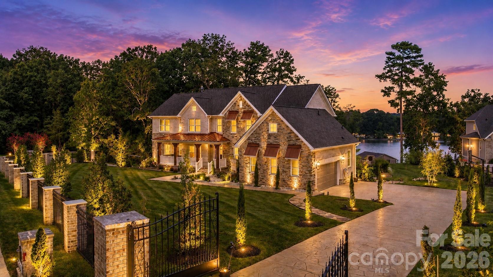 RARE Lake Wylie opportunity—just 2 years old and designed for unforgettable lake living! Perfectly positioned on a manicured, fully fenced 1-acre lot overlooking a deep-water cove, this exceptional home delivers stunning water views, incredible indoor-outdoor living and resort-style amenities.The backyard is a private paradise featuring a spectacular pool & spa with waterfall, cave waterslide and tanning ledge, plus a gazebo, firepit, covered porch and patio. For your watercraft - a covered dock with boat lift, second boat slip and double jet ski floating dock—and the most fun part both the PONTOON BOAT & TWO JET SKIS ARE INCLUDED!!!  Just bring your your bathing suit & sunglasses!Inside, soaring windows fill the 2-story great room with natural light and lake views. The gourmet kitchen and window-wrapped dining room are made for entertaining. Retreat to the main-level primary suite with fireplace, spa-like bath, soaking tub, over-sized walk-in shower and two dream closets. Upstairs features 3 additional bedrooms and a spacious loft/game room.Need more? The 3,000 sq. ft. basement is ready to customize as the ultimate entertaining space or the perfect secondary living area, with a full and a half bath already completed and with direct pool access. Two automatic gates, irrigation and landscape lighting complete this one-of-a-kind property. PLUS Smart Refrigerator w/Hub Screen, washer/dryer, dining table & leather furniture. Near shopping, dining, recreation and Award-Winning Clover schools. Lake life doesn’t get much better than this!