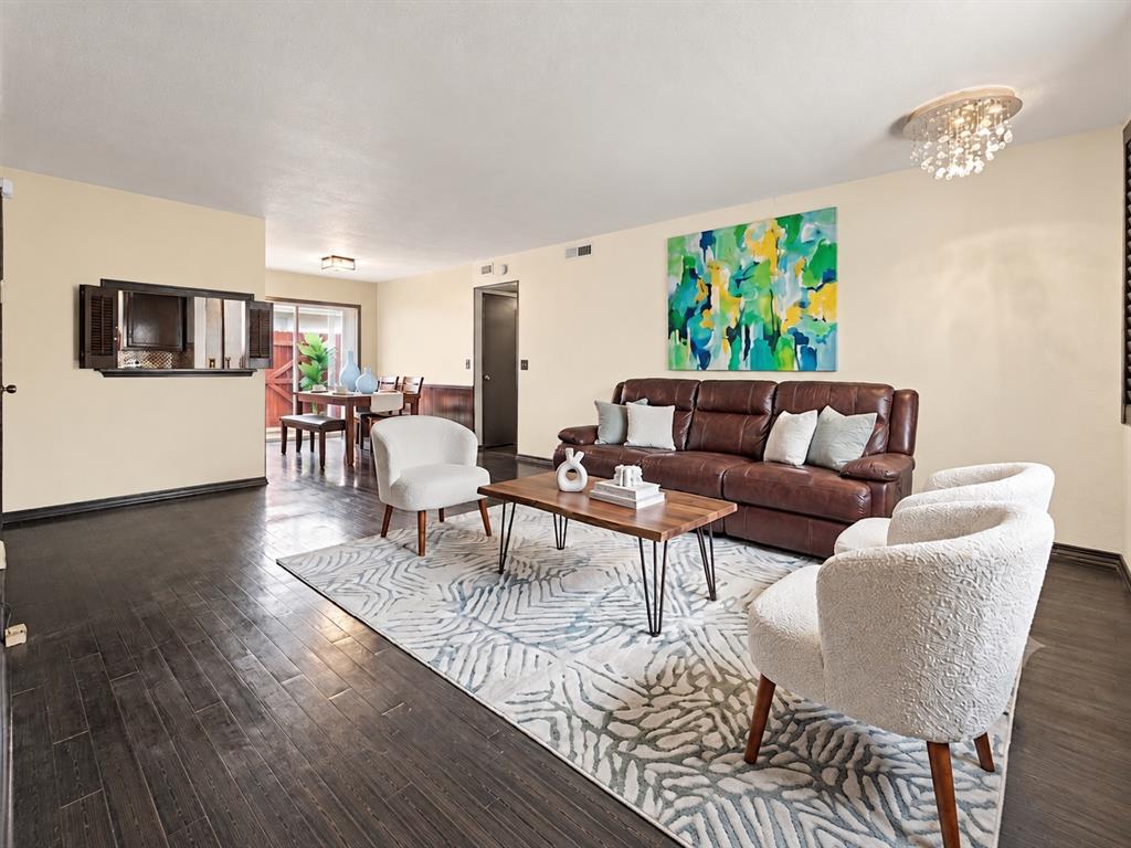 Finding a condo that balances modern updates with real upside potential isn't easy, but this property hits that sweet spot perfectly. Much of the heavy lifting has already been taken care of—the popcorn ceilings are gone, the living room walls sport new paint in a warm white tone, and the bedrooms feature newer, clean carpeting. One of the smartest changes is the clever conversion of a former half-bath into a dedicated laundry room, adding a massive layer of daily convenience you don't always find in these layouts. The main bathroom brings its own unique personality to the table, featuring a bold black toilet, an updated vanity, and retro black-and-white tiling that gives the space an immediate, stylish head start. While these essential updates make the home completely live-able from day one, there is still plenty of room left for you to bring your own design ideas, make further improvements, and build quick equity over time. The galley-style kitchen offers just the right amount of space with a window overlooking the private, fenced-in back patio, which is a perfect spot for outdoor dining or morning coffee. Location-wise, you are perfectly positioned near a vibrant mix of restaurants, everyday amenities, and major shopping hubs, including Living Spaces. It’s the ideal canvas for a buyer who wants a solid, updated foundation in a great neighborhood, but still wants the creative freedom to make it truly their own. The seller has chosen a starting price that prioritizes a quick sale rather than getting every last dollar. Come take a look and see where your ideas fit in!