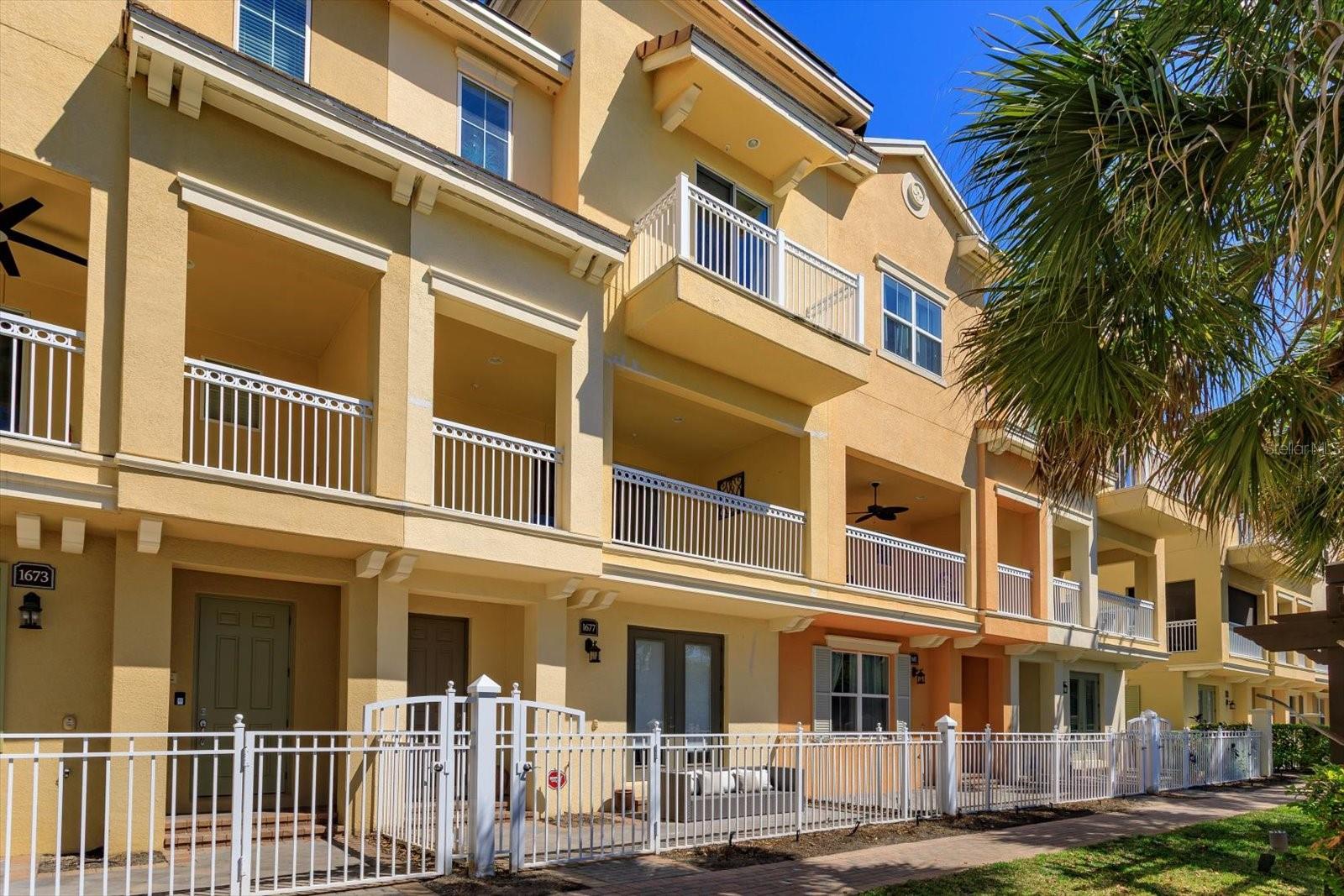 ELEGANT 3-Story Townhome on PRIME LOT!  Only 2 Buildings are DIRECTLY ON LAKE with NO STREET BETWEEN YOU AND YOUR AMAZING LAKE VIEW!  Also, this is 1 of 2 only Interior Buildings that have a DRIVEWAY TO ACCOMMODATE 2 CARS.  Welcome to this stunning 3-story townhome located in the Luxurious Gated Community of GRANDE OAKS AT HEATHROW, where luxury and convenience thrive in the heart of Lake Mary. The Community Association Construction Project on this building is almost completed. NEW WINDOWS, BALCONY SLIDERS, ROOF, STUCCO, EXTERIOR PAINT, BALCONY, RAILINGS, GUTTERS/DOWNSPOUTS and LANDSCAPING & UPDATED PATIO FENCING to come.  Great Time to Purchase! This impeccably designed 3 BEDROOM, 3.5 BATHROOM, PLUS BONUS ROOM AND 2 CAR GARAGE residence offers elevated living with style, space and sophistication at every turn. Step inside through a charming, landscaped PAVERED FRONT PATIO and instantly feel at home. The first floor has a Spacious Ground Floor Bonus/Den/Office with DOUBLE ENTRY DOORS.  Also a second set of Double Doors that Lead to Patio. Can be used as a 4rd bedroom with its own Full Bath, Graced with Tile to Ceiling Shower and Comfort Height Vanity with Granite Counter.  The second-floor main living area is the heart of the home, featuring a Kitchen, Living Room with Tray Ceiling and Dining Area layout all bathed in Natural Light, plus Half Bath. Step out onto your SPACIOUS BALCONY, perfect for morning coffee or evening relaxation with STUNNING LAKE VIEW! Inside, you’ll find TILE FLOORING throughout, PLUSH CARPET in the bedrooms and a BRIGHT, NEUTRAL PALETTE ideal for any interior design style. The chef’s kitchen boasts stunning GRANITE COUNTERTOPS, GE STAINLESS STEEL APPLIANCES, 42" WOOD CABINETS and MASSIVE KITCHEN ISLAND, SLEEK TILE BACKSPLASH and PANTRY, ideal for both everyday living and entertaining.  Upstairs retreat to your Luxurious Master Suite, complete with TRAY CEILING, LARGE WALK-IN CLOSET and another PRIVATE BALCONY to enjoy your Stunning Lake View! ENSUITE has DUAL VANITIES, GRANITE COUNTERS and an elegant STAND-ALONE SHOWER designed to impress.  There are 2 other Generously Sized Bedrooms that share a Full Bath.  Laundry Closet is conveniently located on this floor as well.  This layout is thoughtfully planned with privacy and function in mind, including a rear-facing 2 CAR GARAGE/EPOXY FINISH and Generous Storage throughout. The Grande Oaks at Heathrow Community offers resort-style amenities, including a CLUBHOUSE, SPARKLING POOL/SPA, FITNESS CENTER, TOT PARK and BASIC CABLE all included in HOA DUES!  Exciting news in January FIBER INTERNET will be included in HOA DUES replacing basic cable.  Located in one of Seminole County’s most desirable areas, this townhome is more than a home, it’s a lifestyle. Have peace of mind in this secure, Gated Neighborhood, nestled just minutes from I-4, 417, and 429. Walk to Colonial Townpark to enjoy upscale dining, shopping, and entertainment, or take a short drive, just 45 minutes, to soak in the sun at the beach. Don’t miss your chance to own this majestic retreat in Lake Mary. Call Today for your Private Showing, before it’s gone! This property may be under audio or visual surveillance!