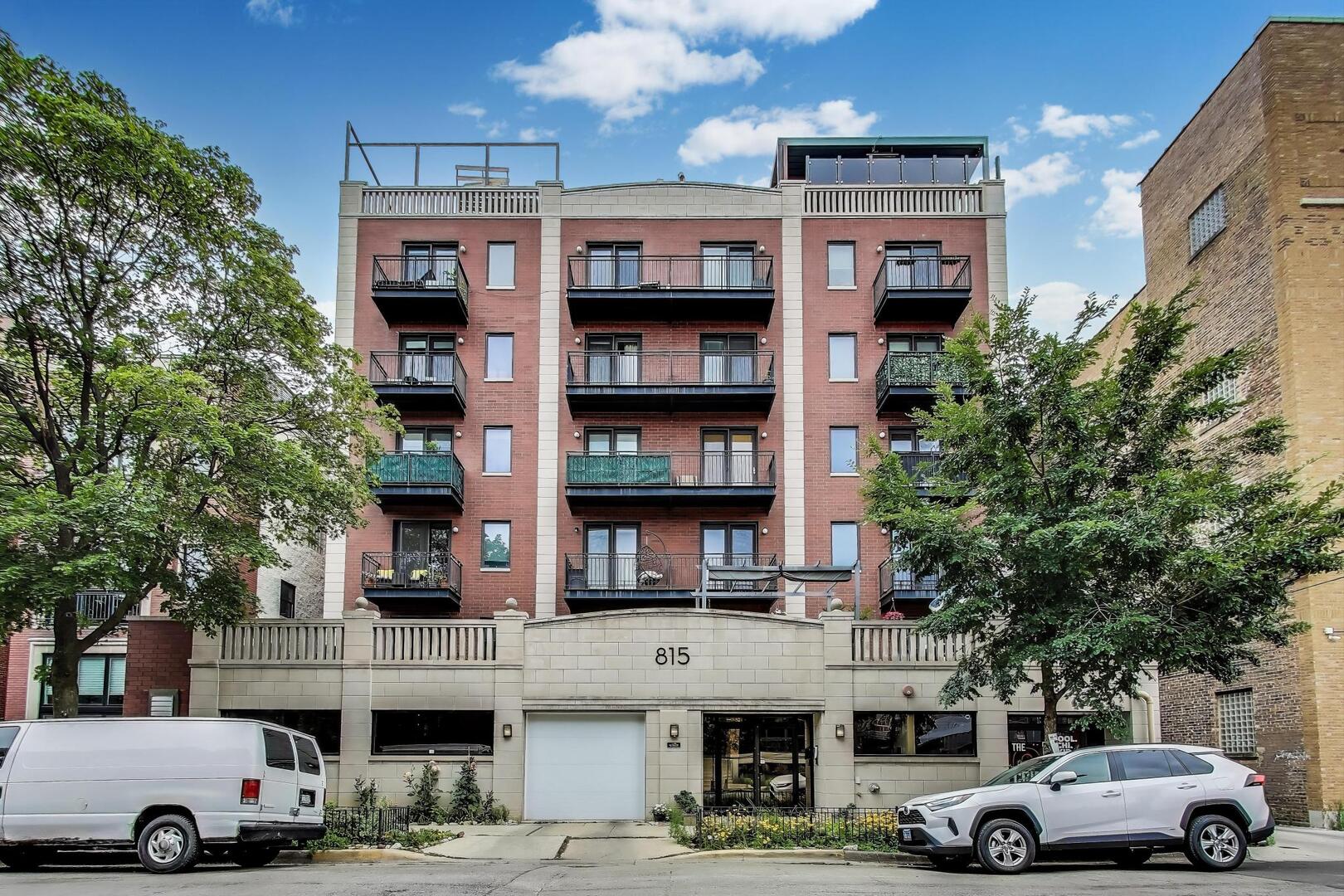 Renovated and flooded with natural light, this corner 2 bed, 2 bath condo in a boutique elevator building offers the perfect blend of modern luxury and city convenience. This spacious condo features an open-concept layout with brand new hardwood floors, new lighting and hardware throughout, and a bright west-facing exposure. The living room is anchored by a cozy gas fireplace, and access to a private terrace ideal for entertaining. The updated kitchen includes granite countertops, new stainless steel appliances, a garbage disposal, dishwasher, and a breakfast bar. The oversized primary suite offers new carpeting, and a beautifully remodeled en-suite bathroom. Additional features include laundry hook-up, Nest thermostat, and a newly installed key fob entry system for the building. One exterior parking space is included in the price. Perfectly situated near top restaurants, cafes, nightlife, parks, and public transit, with easy access to the Blue Line, expressways, West Loop, Bucktown, and Wicker Park. Move-in ready and truly turnkey, this condo offers flexibility to live or rent out, this is a must-see.
