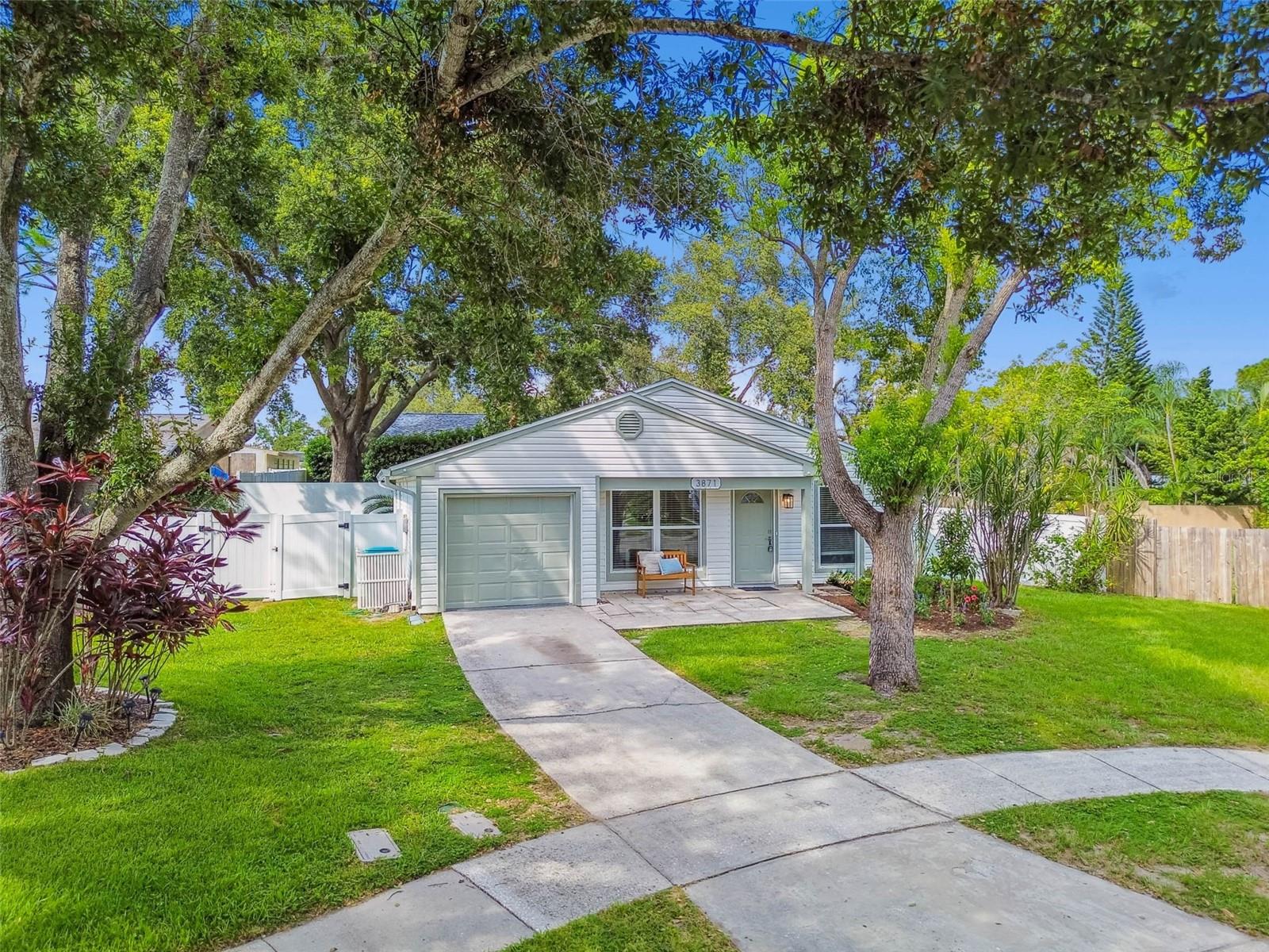 Welcome to your beautifully reimagined Palm Harbor residence, where comfort meets sophistication. This stunning 3-bedroom, 2-bath home has been meticulously redesigned with top-tier upgrades and thoughtful finishes throughout.
Set on an expansive 8,400+ square foot fully fenced lot, the property offers ample space to create your dream outdoor oasis—whether it's adding a resort-style pool, parking your boat or RV, or simply enjoying the freedom of a generous backyard for pets and play.

Step inside and be greeted by soaring 14-foot ceilings that elevate the sense of space and light, instantly making the home feel more expansive than the square footage suggests. Luxury wide-plank vinyl flooring flows throughout, seamlessly connecting the open-concept living areas.

The chef’s kitchen is a showstopper—featuring brand-new custom cabinetry, gleaming quartz countertops, imported tile backsplash, and a full suite of stainless steel appliances. Every detail has been curated to offer style and function in equal measure.

The guest bathroom has been beautifully updated with modern finishes and designer tile. The spacious primary suite offers a private retreat with an elegant ensuite bathroom complete with new vanity and imported stonework.

Major mechanical upgrades provide peace of mind for years to come: new impact windows (2020), new A/C (2023), and a brand-new roof (2024).

Ideally located in a sought-after Palm Harbor neighborhood, this home combines timeless design with practical luxury. Priced to sell—schedule your private showing today before this opportunity slips away.
