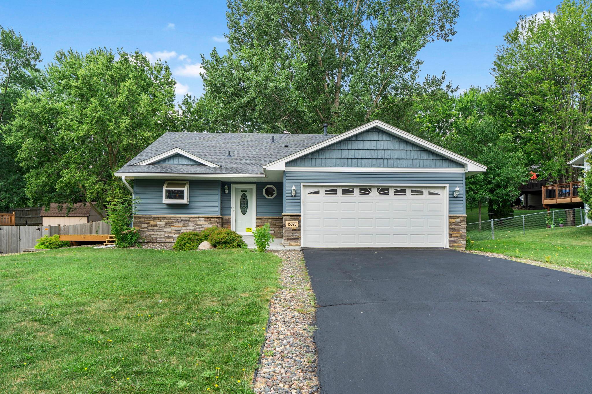 Welcome to this charming three-bedroom, two-bathroom, three-level split in Lakeville, minutes from local shopping, dining, and entertainment. Lakeville offers miles of trails, lakes, and a strong community. This home sits in an established neighborhood with mature landscaping, and has been freshly updated with new carpet and paint throughout.The main level features a spacious foyer with access to the finished two-car garage and a storage closet, perfect as a drop zone. The kitchen and dining room are highlighted by 13-foot ceilings extending to the upper level. The kitchen includes stainless steel appliances and a window above the sink overlooking the front yard. The dining room offers open views to the upper level and access to the brand new 2026 deck through sliding glass doors.Upstairs, the living room is bright and open, overlooking the main level and anchored by a large picture window. The primary bedroom offers backyard views, while the second bedroom overlooks the side yard. A full bathroom sits between both bedrooms with a medicine cabinet and hall cabinet for storage.The lower level offers a family room with lookout windows to the backyard, a 3/4 bathroom, and the third bedroom with backyard views. The utility and laundry room includes countertops, a sink, and cabinetry for storage.This home offers space, comfort, and updated living with new carpet, paint, and a brand new deck. The backyard is a partially fenced retreat with space for a garden, a two-level storage shed with a workbench and industrial cabinets, and a paver patio ideal for a fire pit.