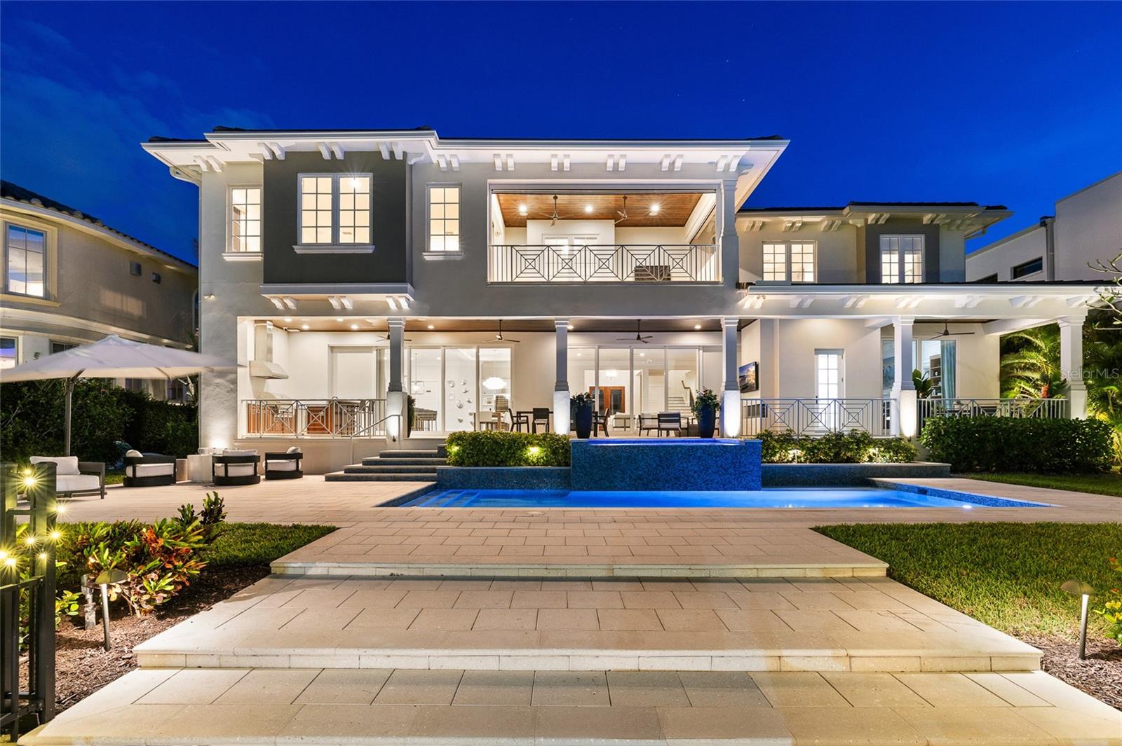 Experience the pinnacle of waterfront luxury in this exceptional coastal estate, where sweeping open water views and unforgettable sunsets set the stage for an unparalleled living experience. Masterfully built by renowned builder Don Hughes, this residence is ideally positioned on a protected deep-water canal just two homes from the open bay—offering both privacy and effortless access to Tampa’s most coveted boating waters.Designed to embrace the very best of waterfront living, the expansive open-concept floor plan seamlessly blends refined elegance with everyday functionality. The chef’s kitchen serves as the heart of the home, overlooking the dining and family areas—perfectly suited for both intimate gatherings and large-scale entertaining. Outfitted with top-of-the-line appliances, including dual Asko dishwashers, a 48” Sub-Zero refrigerator, full Sub-Zero wine storage, and a 48” Wolf gas range with dual ovens, along with an additional Wolf wall oven and microwave, every detail has been thoughtfully curated. Custom cabinetry by Brian Castor and exquisite stone countertops complete the space with timeless sophistication.The main level features a versatile guest suite or private study with a full bath that also functions as a pool bath. Soaring 11’4” ceilings and substantial crown molding enhance the home’s grand scale while maintaining a warm, livable feel.Upstairs, five generously sized ensuite bedrooms accompany the luxurious primary retreat. A spacious bonus room with vaulted ceilings, wet bar, and adjacent full bath offers the perfect setting for relaxation or entertaining. The primary suite is a true sanctuary, thoughtfully designed to capture panoramic water views, and features a private balcony overlooking the heated saltwater pool, spa, and beautifully manicured grounds.Outdoor living is equally impressive, with a covered lanai that seamlessly extends the interior living space and is complete with a fully equipped outdoor kitchen—ideal for enjoying Florida’s year-round lifestyle. Along the water’s edge, enjoy a 540-square-foot dock outfitted with a 13,000 lb Deco boat lift and a 6,000 lb jet ski lift accommodating two watercraft, providing the ultimate setup for boating enthusiasts.Additional highlights include a circular driveway leading to a three-car garage with epoxy flooring, a thoughtfully designed mudroom with a stackable washer and dryer and drop zone, secondary upstairs laundry room, engineered distressed hardwood flooring, solid core doors, a level 5 drywall finish, PGT WinGuard hurricane-impact windows, private elevator, a newer seawall, and a full-home generator—delivering both luxury and peace of mind.This is a rare opportunity to own a meticulously crafted waterfront residence that perfectly balances timeless design, modern convenience, and the very best of Tampa Bay living.