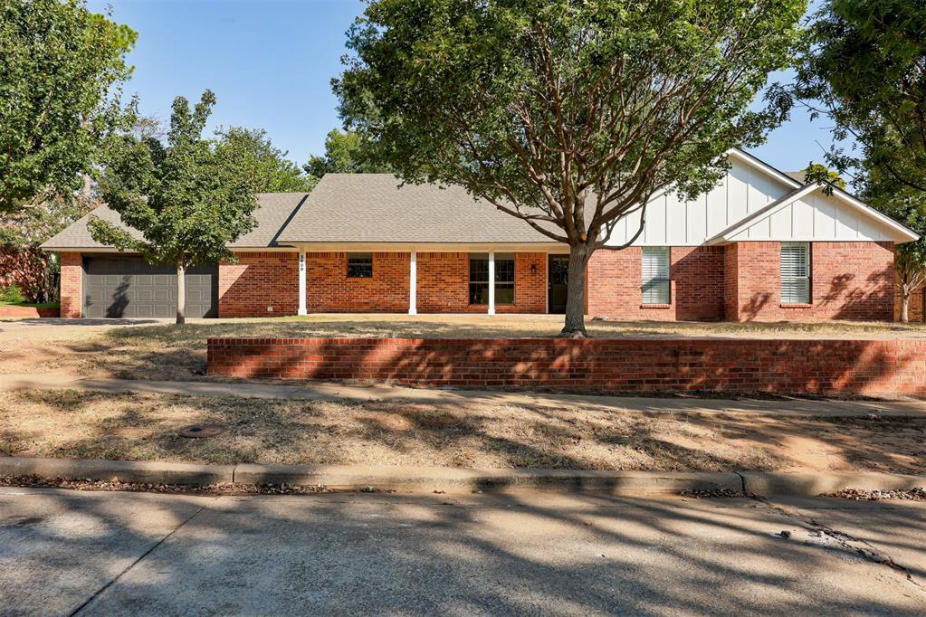 Welcome to 3809 Cedarbrook Drive, a beautifully renovated 3-bedroom, 2.5-bath home tucked into Norman's established Brookhaven addition! This single-story brick residence offers 1,942 square feet of thoughtfully updated living space, plus a versatile bonus office just off the living area. Step inside to gorgeous wood-look laminate flooring flowing throughout the main living space, where a classic brick fireplace flanked by built-in shelving anchors the bright, ceiling-fan-cooled living room.The fully remodeled kitchen is a true showstopper, featuring on-trend sage green cabinetry with gold hardware, sleek quartz-look countertops, a stylish tile backsplash, and stainless steel appliances including a dishwasher, garbage disposal, and built-in microwave.Retreat to the private primary suite, complete with a walk-in closet and en-suite bathroom. Two additional bedrooms share a second full bath, while a convenient half bath sits just off the kitchen.Enjoy total peace of mind with a brand-new architectural shingle roof just installed. Outside, the backyard is framed by mature shade trees and a wood privacy fence atop a classic brick wall, offering a private setting to make your own.Conveniently located near shopping, dining, and top-rated Norman schools, this move-in ready home won't last long. Schedule your private tour today!