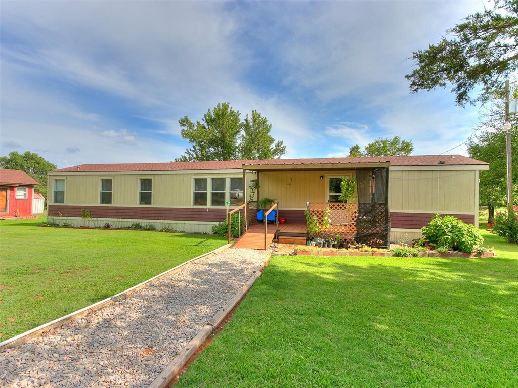 Well maintained property on 5 sprawling acres in Norman on well water, ideal for a farm house with room for gardening, a chicken coup, or horses.    The home has 2 bedrooms, 2 bathrooms, a great size living room  open to the kitchen, so much peace and quiet, and gorgeous views! Outside you will find a nice covered front porch, storm shelter, 18x26 horse/cattle shed, fully fenced pasture, with beautiful trees and a 2-car carport. A new A/C Unit has been installed last year.   If you are looking for an affordable, quiet place with beautiful views to enjoy your morning coffee, this may be the one!