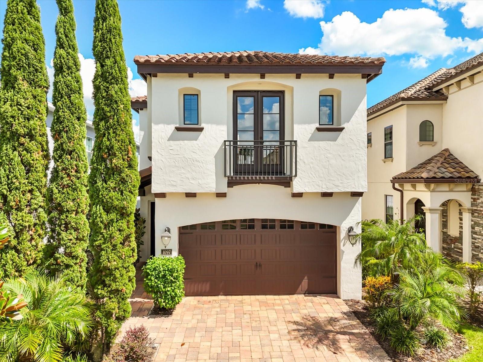 Perched along the rolling greens of the Jack Nicklaus-designed course, this 5-bedroom, 4-bath residence offers nearly 3,300 square feet of masterfully crafted living space in one of Reunion Resort’s most coveted enclaves—Fairway Ridge. This is not your typical vacation retreat. Every inch of this custom-built home exudes personality, detail, and charm. Step inside, and the difference is immediate. A long, gallery-style entry draws the eye into the expansive great room, where light, calm hues, and refined finishes set the tone for gracious living. The surprises begin with a cleverly concealed first-floor bedroom, hidden behind a secret doorway—a detail guests will never forget. From there, a striking custom wood archway frames the open-plan living area, flowing into a chef’s kitchen designed to impress. Rich wood cabinetry, gleaming granite, stainless steel appliances, and an oversized island—large enough to have its own zip code—create a space perfect for casual mornings or elegant evenings. Tucked behind glass doors, a bespoke wine room with dedicated storage and a custom cooler makes entertaining effortless. The living room is equally well-conceived: comfortable and anchored by plantation-shuttered windows that frame views of the resort’s lush landscape. Slide open the glass doors and discover your private oasis. An expansive lanai runs the width of the home, shading you from the Florida sun, while the oversized pool and spa invite endless afternoons of swimming, lounging, and savoring uninterrupted golf course vistas. Upstairs, a wide wooden staircase introduces a generous loft and well-appointed bedrooms, including the serene master suite. Here, a walk-in closet, spa-inspired bath, and oversized shower create a true retreat. Step onto your private balcony, coffee in hand, and watch the sun rise over Reunion’s manicured fairways. This home comes fully furnished and energized with fresh paint inside and out, offering an atmosphere that is at once tranquil and inviting. Beyond your front door lies Reunion Resort’s world-class lifestyle: three Signature Golf Courses (Watson, Palmer, and Nicklaus), tennis, pickleball, member events, a state-of-the-art waterpark, and dining experiences from rooftop tapas to refined chophouse cuisine. A golf-cart-friendly community, Reunion is both vibrant and intimate, with tree-lined streets, parks, and endless opportunities to gather. Location is everything—and Reunion puts you just minutes from Orlando’s famed theme parks, shopping, and beaches. This property participates in a short-term rental program, with an ACTIVE REUNION RESORT MEMBERSHIP already in place—an added advantage for those seeking both enjoyment and investment.

Rare. Refined. Ready to welcome you. Schedule your private tour today.