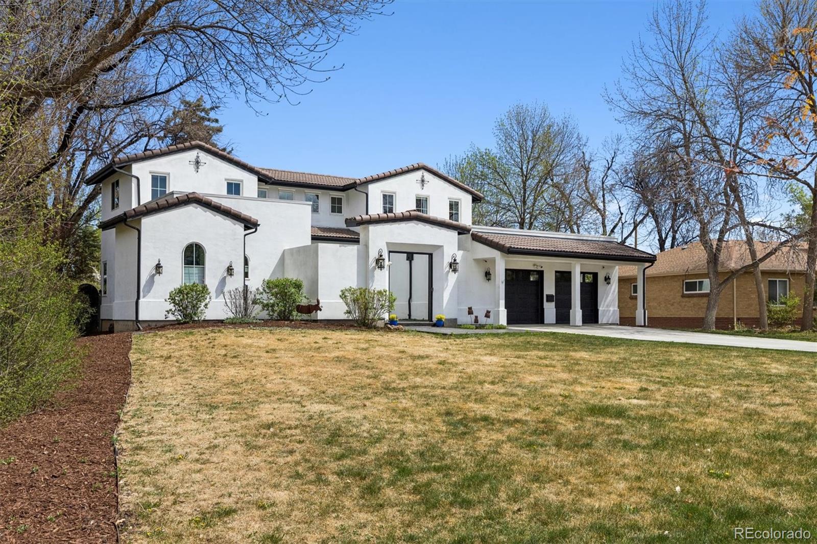 Exceptional opportunity on an expansive 20,600 sq ft lot in Observatory Park. Mature, well-maintained landscaping provides privacy and a serene setting, with three courtyards and oversized front and back yards ideal for outdoor living, entertaining, and pets.This California-style home offers timeless character and beautiful custom built-ins throughout. The main level features a main-floor primary suite with a custom-built walk-in closet. The primary bathroom was remodeled in October 2025 and includes radiant heated floors, tub, and a rain shower spa experience. Hardwood flooring extends throughout the main level, adding warmth and elegance. The main level also includes a guest bedroom and a dedicated office space with built-in shelving and desk—perfect for work-from-home living.The main floor living spaces are expansive, bright, and designed for entertaining, seamlessly connecting the family room and kitchen. The updated kitchen (2022) features premium appliances including a BlueStar 8-burner gas range, Sub-Zero refrigerator, Wolf microwave, and a large granite island with abundant storage, creating a functional and inviting gathering space.Upstairs includes two bedrooms, each with its own en-suite bathroom.Designed for indoor-outdoor living with all new Marvin French double exterior doors, the home opens beautifully to multiple courtyards and outdoor areas. A custom 6-zone sound system enhances both interior and exterior spaces.Additional features include a custom-cooled wine cellar, a large finished basement with workout space, brand new carpet, refinished hardwood floors (2022), a new roof (2022), and a 2022 washer and dryer. The backyard is partially turfed with a designated sprinkler zone, perfect for pets, and includes a convenient dog door. The outdoor entertaining area features an Argentine wood-burning grill, Napoleon 5-burner inline gas grill, chimenea, and Tuff Shed. Prime location close to parks, trails, shopping, and dining.