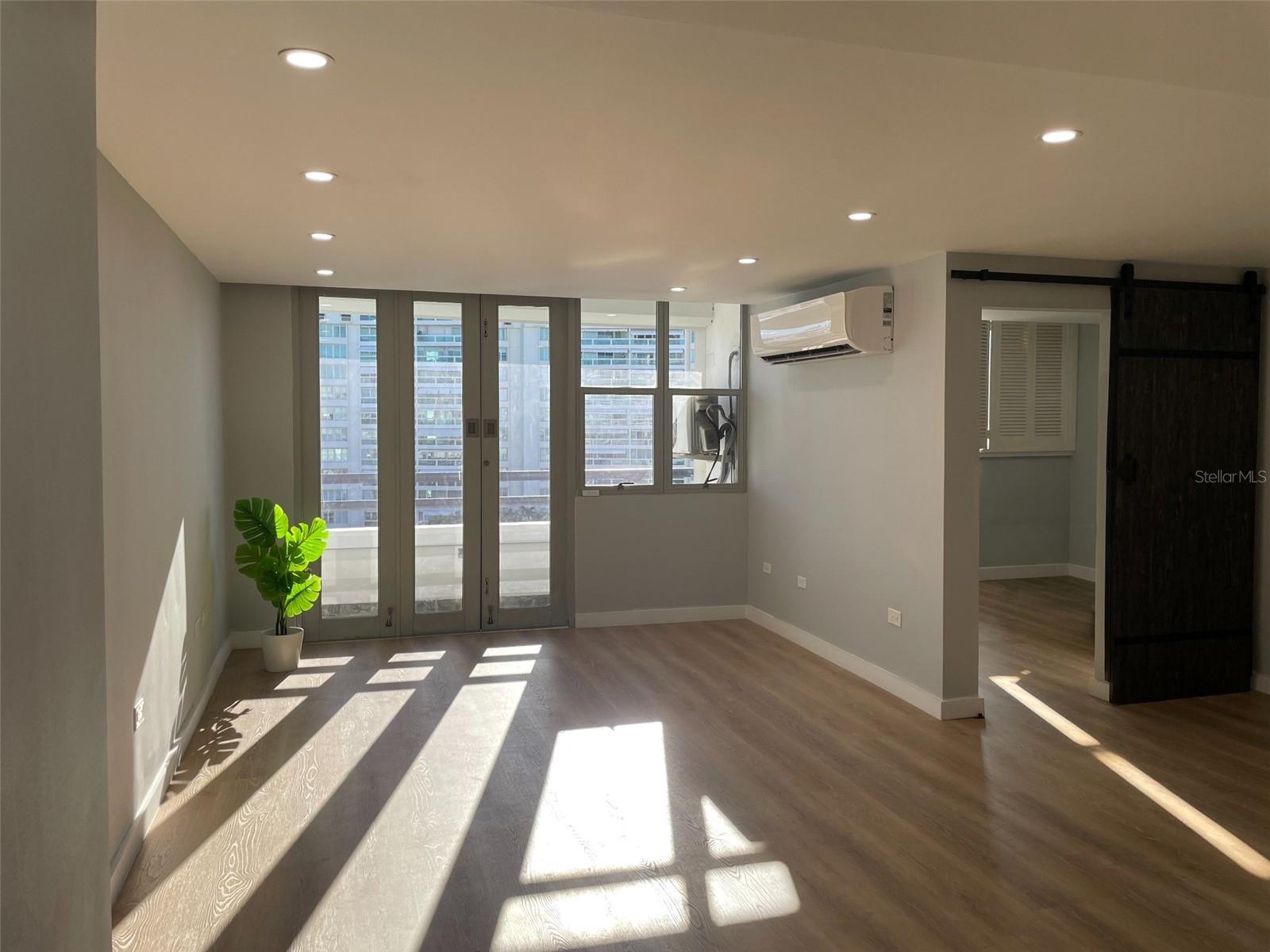 Completely remodeled, this eighth-floor apartment at Playa Dorada combines contemporary interiors with beachfront condominium living in Isla Verde. This one-bedroom, two-full-bathroom residence features a bright, open living and dining area leading to a balcony with city and mountain views.The updated kitchen features white cabinetry, wood-tone countertops and stainless steel appliances. The bedroom includes a closet and an adjoining full bathroom with a double vanity and glass-enclosed shower. An additional open area offers flexibility for a home office or TV nook, with wiring for internet. A second full bathroom with a stacked washer and dryer, wood-look flooring, recessed lighting and sliding barn-style interior doors complete the interior. Additional features include storm shutters, installed cable TV wiring, a designated generator outlet inside the apartment and one assigned covered parking space.Playa Dorada offers direct beach access, a swimming pool, gym, playground, landscaped grounds, controlled access and an event room available for rent by residents. The building’s generator serves common areas. Enjoy walks along the shore, surf lessons, sailing excursions and other water activities at nearby Pine Grove Beach, plus Isla Verde’s restaurants, cafés and casinos. Supermarkets and pharmacies along Avenida Isla Verde add everyday convenience, with convenient access to Luis Muñoz Marín International Airport, Piñones with its coastal dining and Condado, including Ashford Hospital.