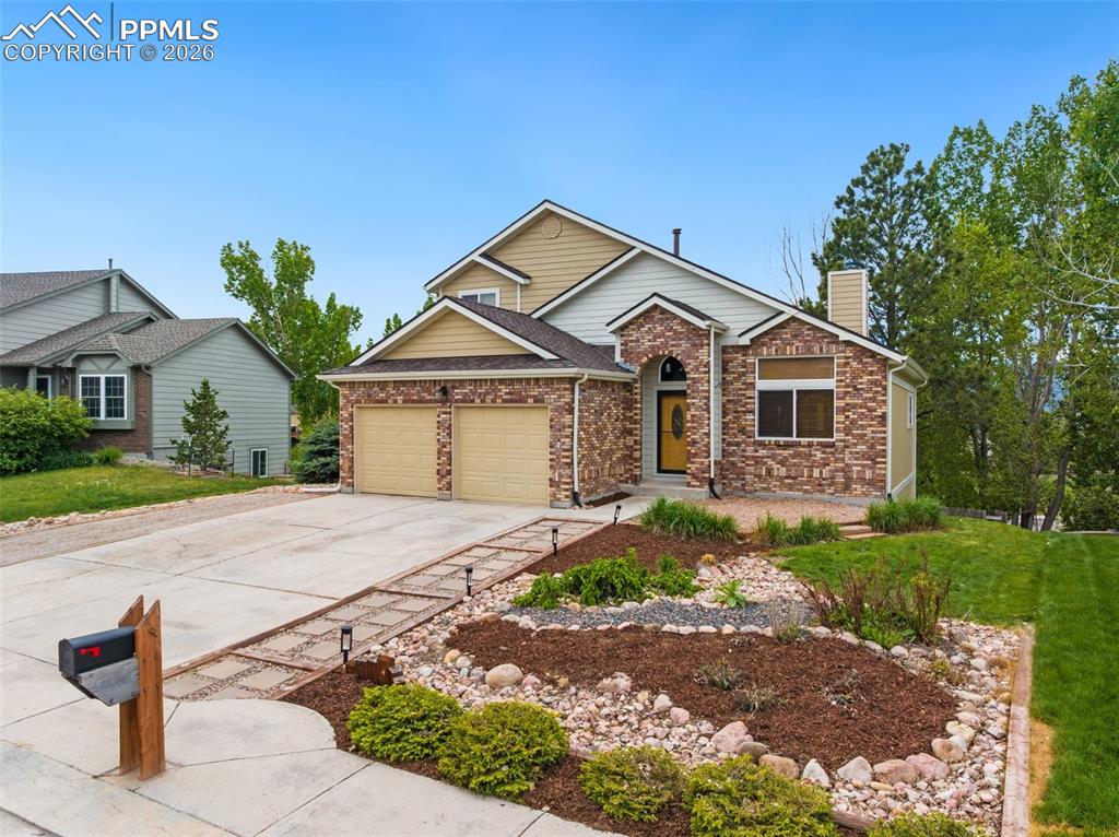 Experience Colorado living at its finest in this beautifully updated 2-story home with beautiful views of Pikes Peak and the Front Range! With 4 bedrooms, 4 bathrooms, and 2,952 sq ft, this home blends timeless charm with thoughtful updates throughout. Step inside to find soaring vaulted ceilings with rich wood ceilings, two cozy wood-burning fireplaces on the main level, and newly added tile flooring throughout the entire main level. The remodeled kitchen features custom cabinetry with additional built-ins, offering both style and practical storage. From the kitchen and family room, step out onto the deck overlooking the mountains—perfect for morning coffee, evening relaxation, or entertaining with a view.  Enjoy new carpet, custom baseboards throughout, and a full walkout basement with flexible space for future expansion, entertainment, or multi-use living. The attached garage is equipped with 220V electric and equipped for electric vehicle charging. Enjoy the beautiful views, updated landscaping and a custom chicken coop—perfect for those craving a touch of country charm. Located in school district 20, this home is within walking distance to the local elementary school and fire station, and just minutes from shopping, dining, Fox Run Park, and scenic hiking trails. With breathtaking views, modern upgrades, and unbeatable convenience, this home is truly a rare find. Come see it for yourself!