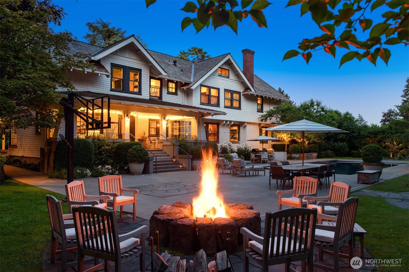 Before Medina became famous for 'who' lives on the Gold Coast, visionary entrepreneur Edward Webster and his notable architects set the standard for 'how' when they built The Gables. This legacy estate is an escape for all seasons and a timeless asset. Created for modern life with a conscious investment in quality and set discreetly down a lane and behind magnificent hedges, this uber private estate with Hamptons vibes commands .75 acres along fabled Overlake Drive. Modernized and effectively rebuilt by Toth Construction, "Medina's first great home" showcases magazine-worthy interiors by Rocky Rochon. Luxurious details, custom furnishings and classic materials set the scene for large affairs and intimate living. Grandeur unfolds in stages, from the motor court to the deep entertaining and dining porches, magical pathways wind past the elliptical pond, espaliered apple trees, and brilliant hydrangeas, through the gates to lush gardens bursting with lavender and white roses scenting the enchanting pool and entertaining areas. At dusk, the welcoming garden comes alive with fairy lights and beckons all to gather around the stunning outdoor fireplace or meander around to the expansive play lawn. Beautifully featured in print and onscreen The Gables brings the architectural style, character and quality building details found in Seattle's best homes to the Eastside's most coveted address--a rare investment, built to last.
