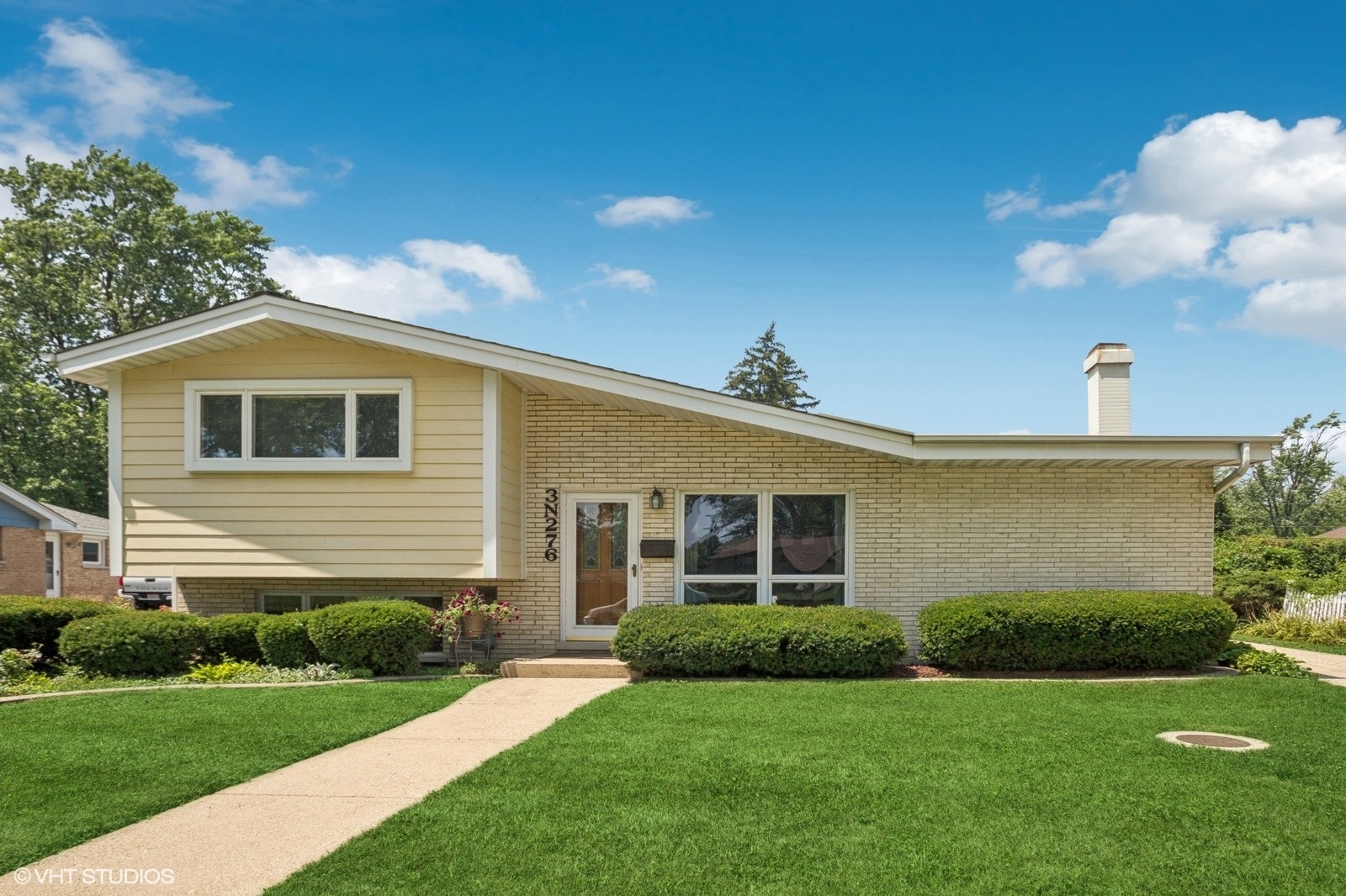 Welcome to this beautifully updated split level in desirable Elmhurst!  This home features an open floor plan with vaulted ceilings, gleaming hardwood floors throughout, a stone fireplace, 3 spacious bedrooms, 2 full updated baths, and an updated kitchen with island and stainless steel appliances. The spacious living room and dining room offer plenty of room for entertaining. The lower level includes a generous sized family room, updated full bath, laundry and additional storage in the concrete floor crawl space.  The oversized 2.5 car garage has ample room for storage or workshop. Located in the highly desirable Elmhurst 205 School District with walking distance to Fischer Elementary and Churchville Middle Schools. Conveniently located for commuters with easy access to major highways, close to parks and playgrounds, shopping, Elmhurst town center. Recent updates include new and refinished hardwood floors on main and upper level, new vinyl plank flooring in lower level, updated kitchen includes new backsplash and freshly painted cabinets, new tiling in lower level bath. Freshly painted and move-in ready, this home is a must see!