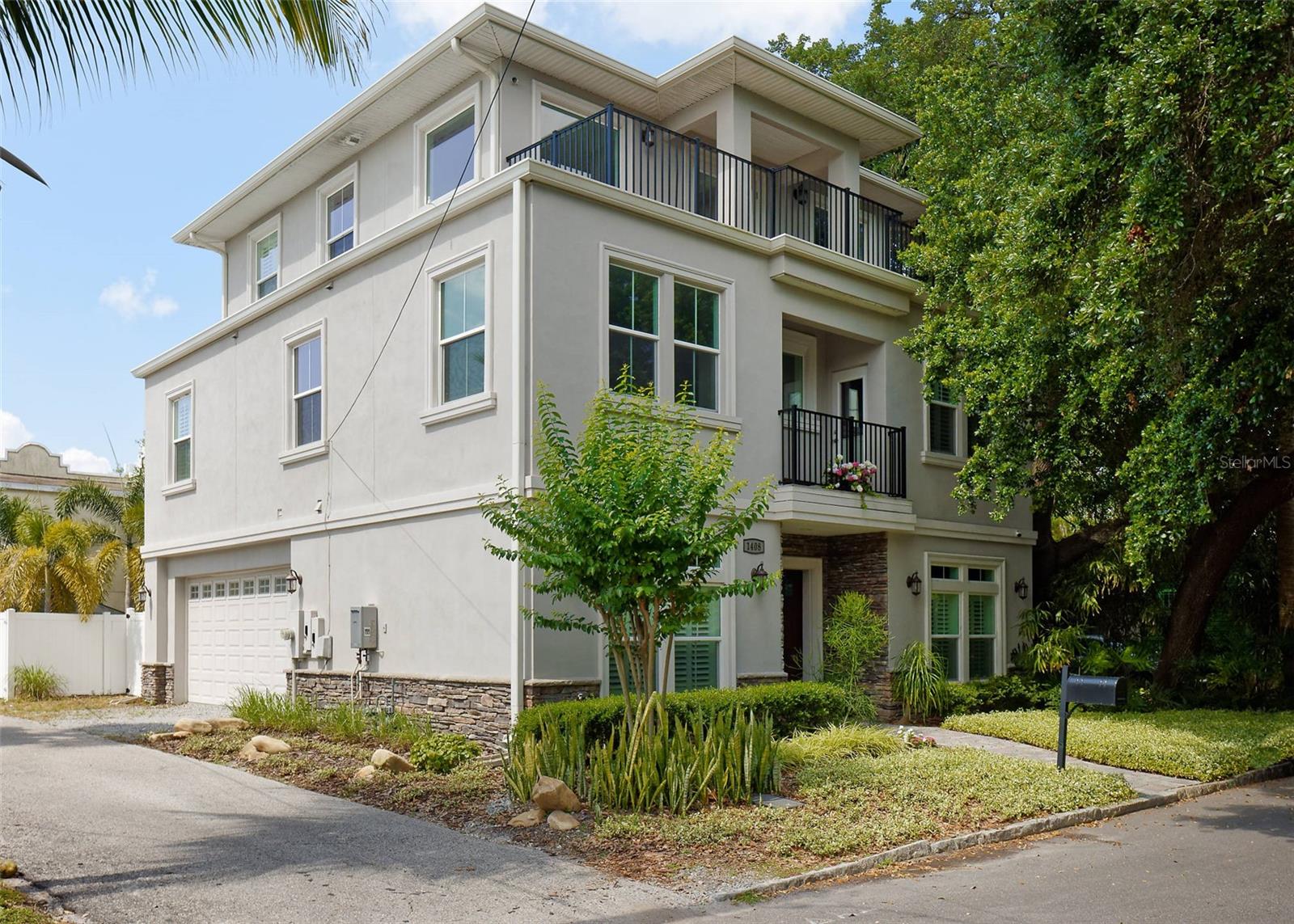 Start Living Your Best Hyde Park Life! 6 Year NEW custom-built home by Bob Bell Homes within easy walking distance of Old Hyde Park Village, convenient to the Selmon Expressway and downtown Tampa. Enjoy the privacy of the secluded third floor deck showcasing a lovely Tampa skyline view from the treetops, with a cup of coffee in the morning watching the sunrise, or enjoying your favorite aperitif while watching the golden sunset colors on the skyscrapers, just a few steps from the master bedroom. Parties and Holidays will never be the same (rain or shine) with the patio deck that has both an outside and inside sitting area with a wet bar and fridge. It's a great place to watch fireworks over Curtis Hixon Park or SpaceX launches from Cape Canaveral over the Tampa skyline! From the foundation and oversized two-car garage on the first level to the third level master bedroom, the wet bar/loft area and rooftop patio, all aspects of the Construction of the home were designed and monitored during construction to ensure the best quality and maximum use of the available space. The large custom kitchen features natural stone counters, extensive custom cabinetry, two wall ovens (one is also a large microwave), gas cooktop, pot filler cooktop faucet, and a large hood venting to the outside. All three levels feature beautiful, dark-wood floors and stairs. All bedrooms and front first floor windows feature beautiful custom plantation shutters, for privacy. The first floor windows have custom upper transom windows for additional natural light. The side yard features a secluded sitting area under a lovely shade tree canopy, with a beautiful contemporary horizontal plank cedar fence, iron gate, and low-maintenance artificial grass making it an inviting place to sip a cool drink on a hot day. The open floorplan construction, with the staircase in the center of the home, allows for all second floor bedrooms to partake of the full amount of nature’s light for each room through oversize windows. The laundry room with natural stone countertops and custom cabinets is in the center of the second floor for added convenience. There's an additional balcony on the 2nd floor which can be accessed from the loft and the west side bedroom. The two other second-floor bedrooms feature large custom walk-in closets. The large master bedroom faces east, south, and west for sunlight all day long, spanning the width of the third floor and almost half the depth. It has an enviable luxurious master bath, with claw pedestal tub, oversize shower and a custom-designed walk-in closet. Just a few feet away is the secluded and peaceful loft and patio deck area. Some of the technical aspects of the home are the 3 zone A/C system, one for each floor, and it is extensively wired for CAT6 internet connections and coax cabling for TV to every bedroom and living space. In addition, the first floor and third floor sitting areas are wired for surround sound in the walls and ceilings. There is a 10-camera video surveillance system that is accessible anywhere by phone. All are wired thru a central second-floor media closet for ease of change and maintenance. The roof features tightly sealed spray-in foam insulation for energy efficiency. All windows are double-pane for energy efficiency and hurricane-rated to 150 mph. There are too many nuances to this fascinating home to mention here. The website (WWW.1408azeelestreettampa) is available to learn more about this wonderful home.