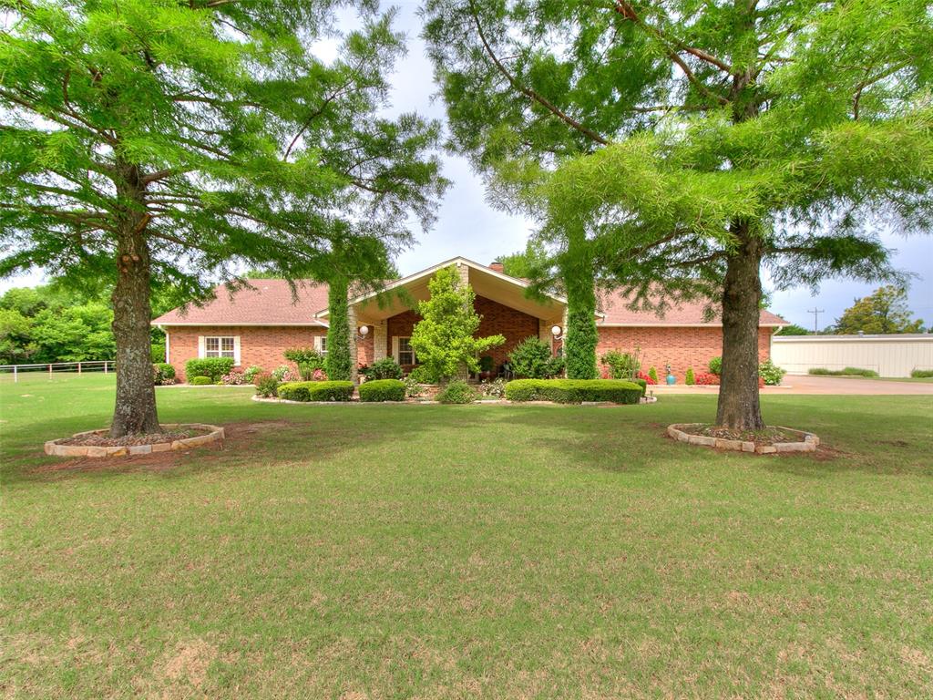 Oh WOW! If you're needing space, this one has it. 3 VERY spacious bedrooms, plus a Flex room that would be a great study, nursery, workout or craft room. Welcoming entry is open to the HUGE living & formal dining space featuring exposed beams on the ceiling, wood look vinyl flooring, double ceiling fans & gas log fireplace w/built-in entertainment cabinet. The Chef's kitchen has a large center island w/lots of storage, as well as lots of cabinets, drawers & counter space, double ovens, microwave, gas cook top, & wonderful breakfast bar. The primary suite has Double mirror door closets AND a large walk-in closet, double vanity, soaker tub, & full tile shower. The secondary bedrooms are also HUGE & offer double mirror walk-in closets. The guest bath has lots of storage, full tile shower & separate bathtub. This home has plantation shutters throughout, a vault room in the house, a safe room in the garage, Salt water in ground pool, covered pergola patio, pergola area that's wired for a hot tub, lush landscaping front & back, Generac generator, 40x60 shop w/half bath & greenhouse. So much to say... you just need to come see for yourself.