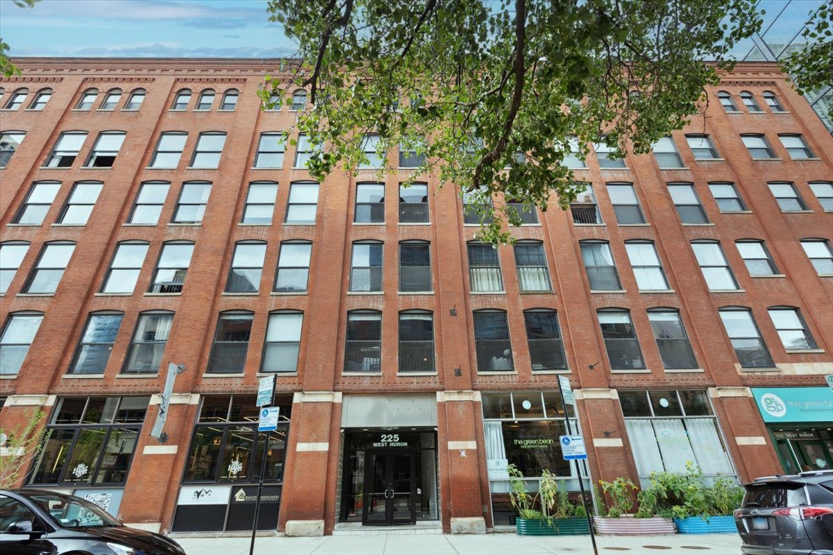 This RARE 2 Bedroom  brick/timber loft @ 225 Huron, has been beautifully upgraded thru-out. This gorgeous corner unit has an exceptional & super functional floor plan. Tastefully renovated in 2019, open kitchen that features white cabinetry, updated hardware, quartz countertops, slate tile flooring,  open shelving, backsplash, & breakfast bar with ample seating. Oversized family room perfect for entertaining. High ceilings, & Awesome light thru-out. Lovely primary bedroom featuring walk in closet that has been professionally organized. Nice sized 2nd bedroom with great options for office/den or guest bedroom. Gorgeous Bathroom updated as well in 2019 with chic glass panel shower/tub, new tile, vanity, and  flooring. Soundproofed exterior walls with double pane windows. New HVAC 2024. Ample professionally organized closet space thru-out. In unit washer dryer (not all units in building have this!) Close to both transportation/shopping/quick access to expressways and everything else River North Neighborhood has to offer. Extra storage. Garage Parking available @ flair tower $275 per month. Other building amenities; bike storage, beautiful rooftop deck, gym, nighttime doorman. Welcome Home!