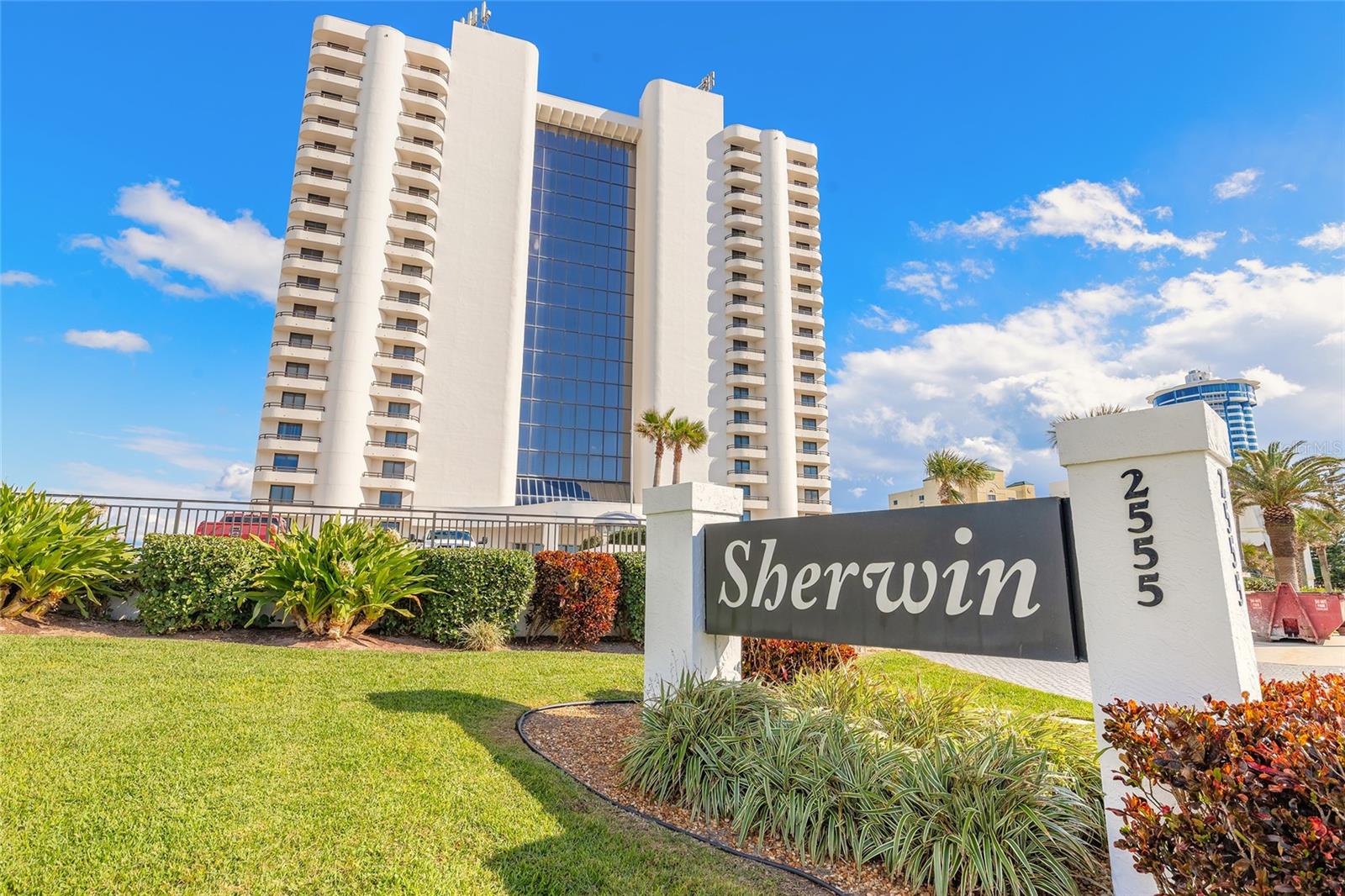Spectacular direct oceanfront living awaits at The Sherwin! This stunning end-unit residence offers breathtaking ocean views from a wraparound balcony and expansive windows that fill the home with natural light. Enjoy gorgeous vistas from every room, including east-facing balconies overlooking the inlet waters, the Daytona International Speedway, and unforgettable sunset skies. This spacious 2-bedroom, 2-bath home features private west-facing balconies off both bedrooms, while the primary suite also enjoys direct oceanfront access via the wraparound balcony. The primary ensuite is thoughtfully designed with a large walk-in closet, deep soaking tub with shower, separate vanity area, and a modern barn door for added style. The guest bedroom offers a generous walk-in closet and a full bath, perfect for hosting family or friends. Designed for comfort and entertaining, the open kitchen and dining area feature a spacious breakfast bar, ample cabinetry, and seamless flow into the living space. A full in-unit laundry room and oversized closets provide excellent storage for all your beach gear. Recent renovations include luxury wood-style vinyl plank flooring, new AC and heat system, new water heater, updated bathroom fixtures, new refrigerator, oven, microwave, updated kitchen hardware, and fresh interior paint, creating a move-in-ready coastal retreat. Ideally located in the heart of Daytona Beach Shores, you're just minutes from grocery stores, casual and fine dining, parks, and all the best the area has to offer. Wake up to endless sunrises, unwind with spectacular sunsets, and enjoy the beach lifestyle you've been dreaming of. Unit comes with two assigned parking spaces. The Sherwin allows rentals with a minimum 2-week rental period. Hot water heater and AC 2022. Lobby is currently being renovated. Expected to be completed in the next month or two. Renderings including in photos and no special assessments outstanding. All information deemed accurate but cannot be guaranteed.