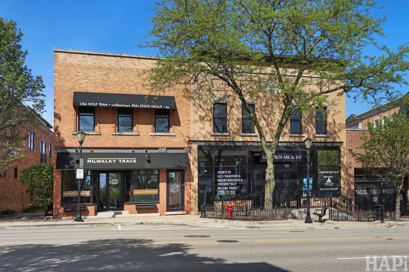 This exceptional investment and owner-user opportunity is a premier mixed-use trophy asset situated in the heart of Libertyville's vibrant Downtown Core at 545-547 N Milwaukee Avenue. Downtown Libertyville properties rarely change hands especially ones as turn key and stable.  This meticulously maintained two-story building perfectly blends historic architectural charm with high-end modern infrastructure. For the owner-occupant, this property offers a rare chance to elevate your brand and your team's quality of life by establishing a corporate headquarters on the second floor. The 6000 square foot modern open floor plan office suite provides a sophisticated workspace characterized by premium finishes and an abundance of natural light, fostering a true live-work-play environment where employees are steps away from award-winning dining, boutique shopping, the Metra station and residential neighborhoods. The building is unique in that it features multiple tenants across its diverse floor plan, which significantly enhances investment stability through diversified income streams. The current owner-occupant is prepared to vacate to accommodate your business or remain in place under a lease-back agreement, offering ultimate flexibility for your transition. From an investor standpoint, this is a recession-resistant asset that allows you to add a high-performing trophy property to your portfolio. The ground floor is anchored by two stable restaurant tenants signed to long-term leases, providing a reliable and diversified cash flow from day one. The building is fully ADA compliant and all parking requirements have been satisfied, which is a significant competitive advantage in a dense downtown corridor. Originally built in 1920 and significantly remodeled in 2008, the property features high-end interior build-outs including slate tiling and hickory flooring. Furthermore, the local economy is poised for even greater growth as Libertyville will be adding close to 300 residential units to its downtown district in the coming years. This increase in density will help bolster the already high visibility and heavy pedestrian traffic, ensuring the long-term desirability and value of this downtown core location. For showings or financial information